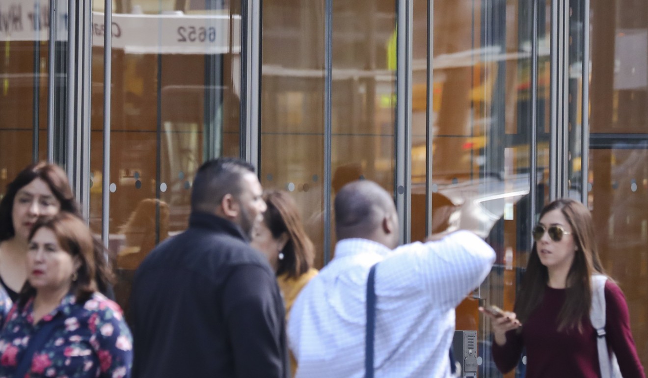 People walk by The New York Times headquarters, in New York. Photo: AP