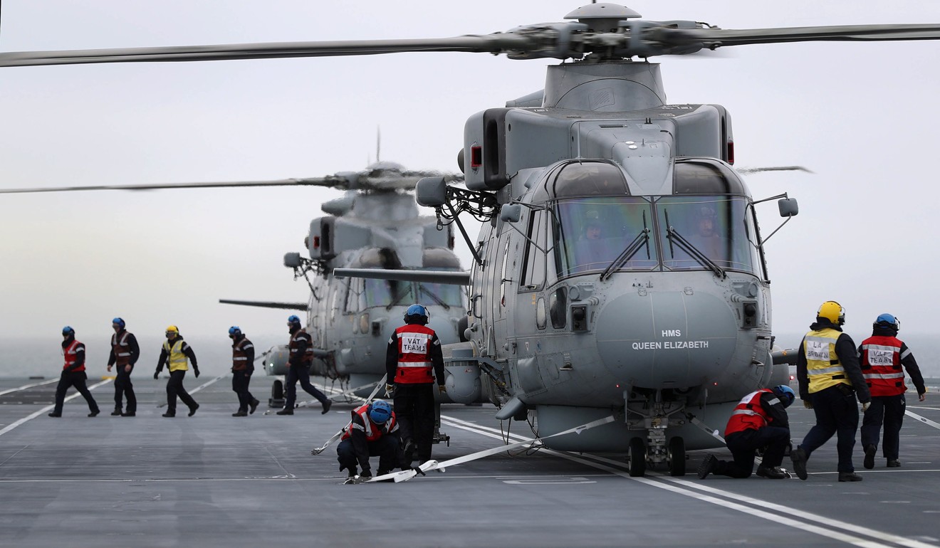 Two Merlin helicopters aboard the British Royal Navy aircraft carrier HMS Queen Elizabeth. Photo: EPA