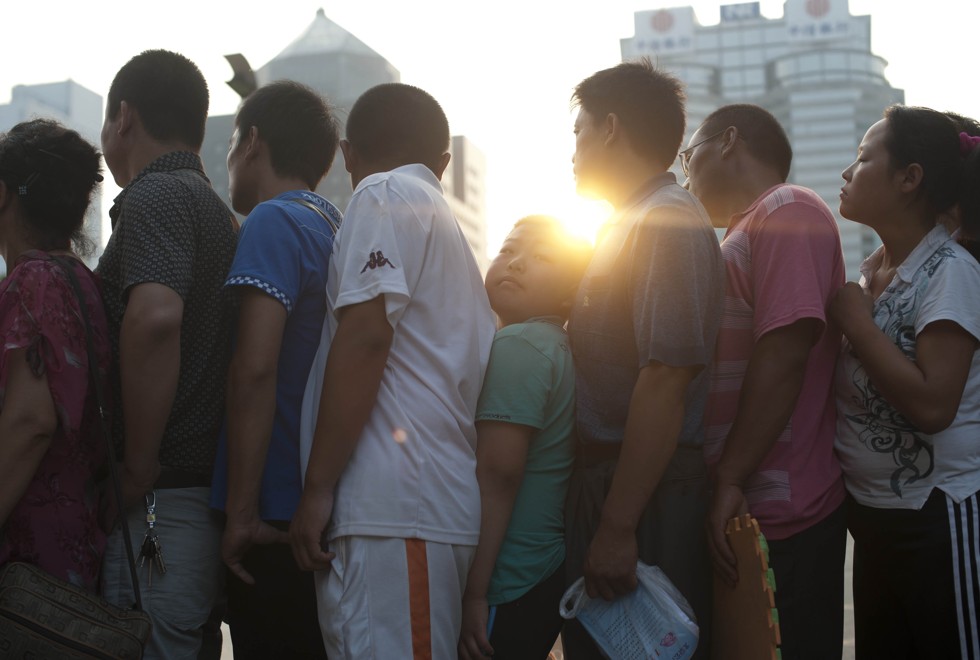 Parents queue in the early morning to consult doctors at a children’s hospital in Beijing. Picture: AFP