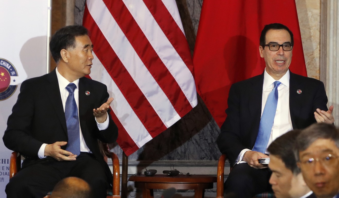 Chinese Vice Premier Wang Yang, left, and Treasury Secretary Steve Mnuchin, take their seats after speaking at the opening of the US-China Comprehensive Economic Dialogue on July 19, at the Treasury Department in Washington. Photo: AP