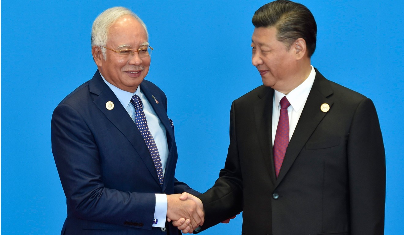 Malaysian Prime Minister Najib Razak with Chinese President Xi Jinping. Najib must continue to court Chinese investment if he is to cling to power. Photo: AFP