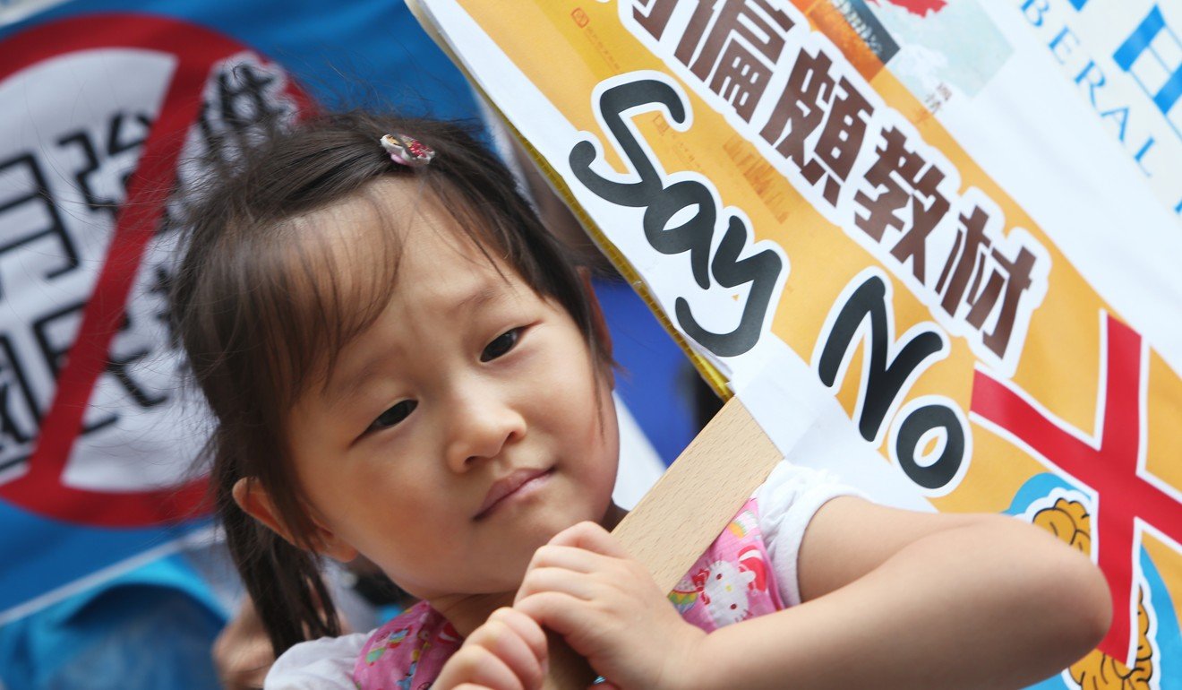 Felica Lui, four, attends a protest held by the Liberal Party in 2012 opposing national education. Photo: Sam Tsang