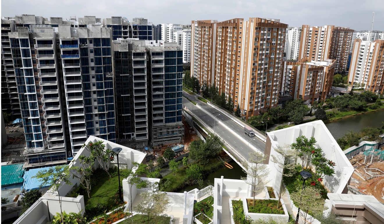 A condominium construction site next to a public housing estate in Singapore. Market watchers are concerned that the high bids on property by mainland Chinese could cause price inflation. Photo: Reuters