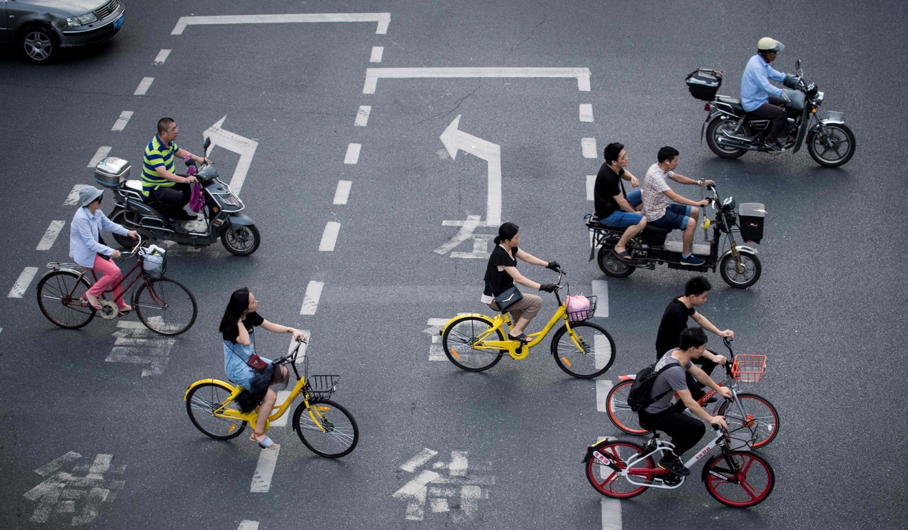 Cyclists pictured in Shanghai. Most are using shared bikes. Photo: AFP