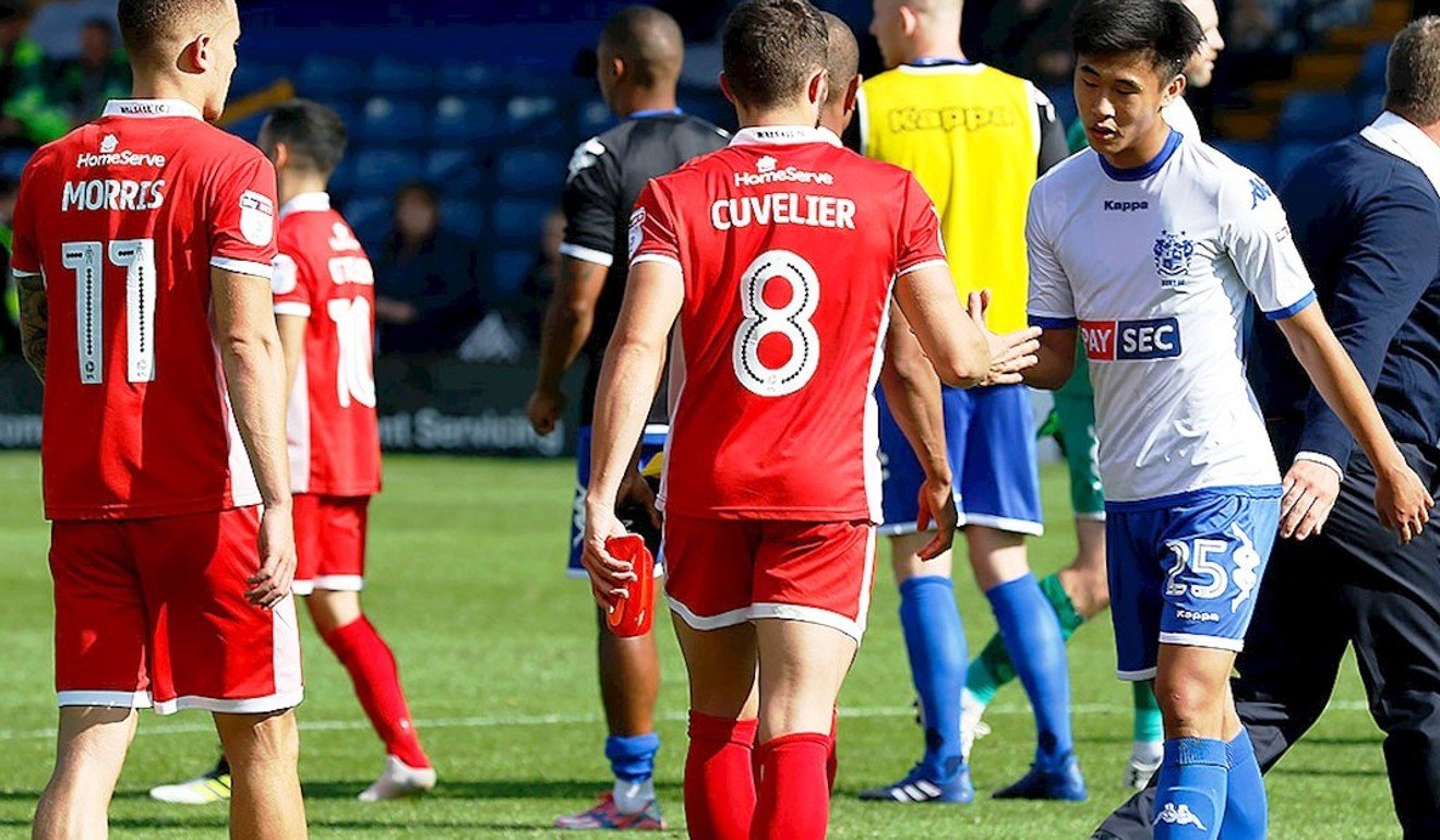 Tsun Dai shakes hands with Walsall players after the game. Photo: Bury FC
