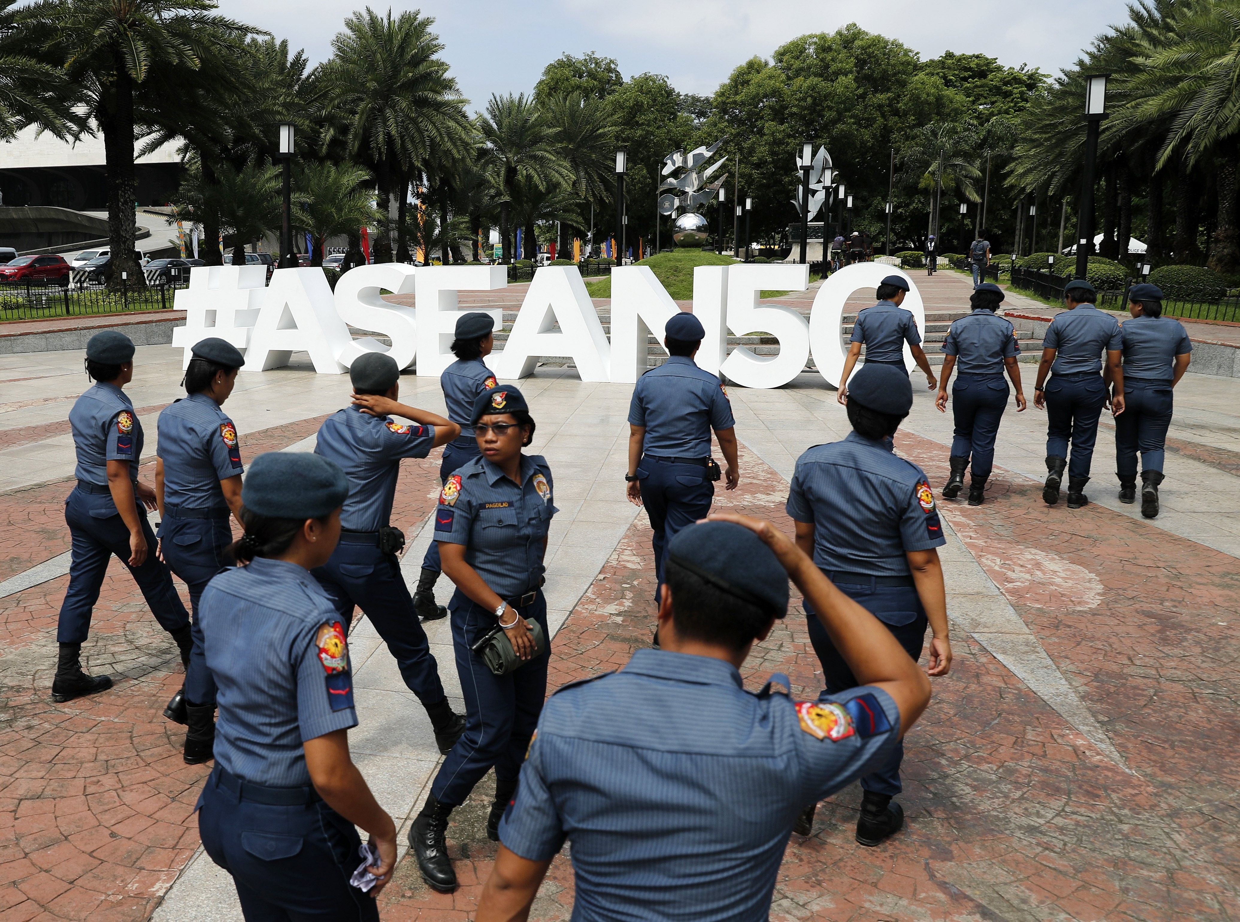 Filipino police officers patrol the vicinity of the venue of the Asean Foreign Ministers’ Meeting in Manila, on August 6. Asean, which turns 50 this year, rarely celebrates itself, and critics have long predicted its imminent demise, but there are good reasons to consider its model. Photo: EPA