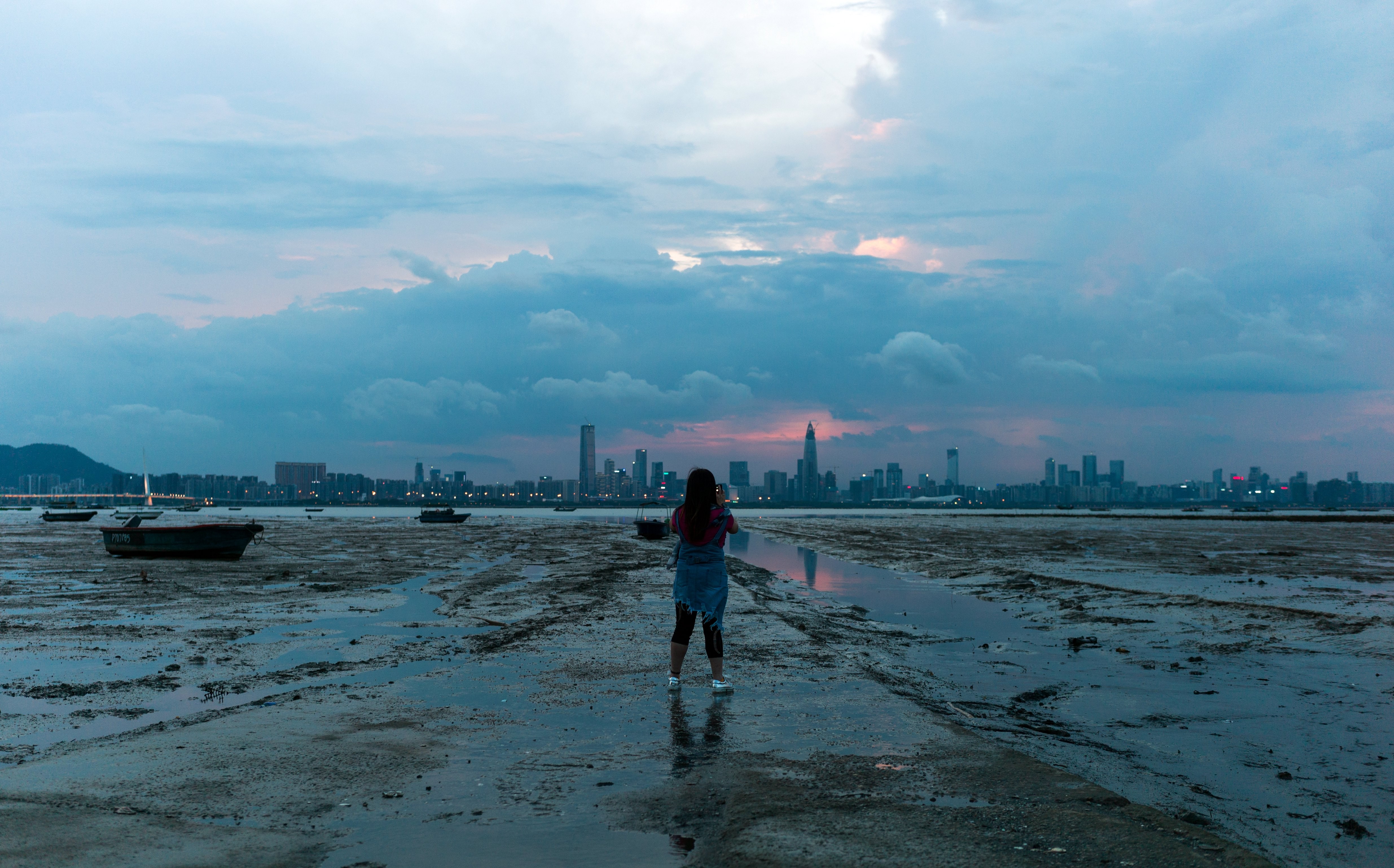 The city of Shenzhen is seen across Deep Bay in Lau Fau Shan, Hong Kong. Hong Kong started as a free port for Chinese trade, but today it is an offshore renminbi hub. This evolution reflects its traditional “connector” role giving way to that of a “financier”. Photo: EPA