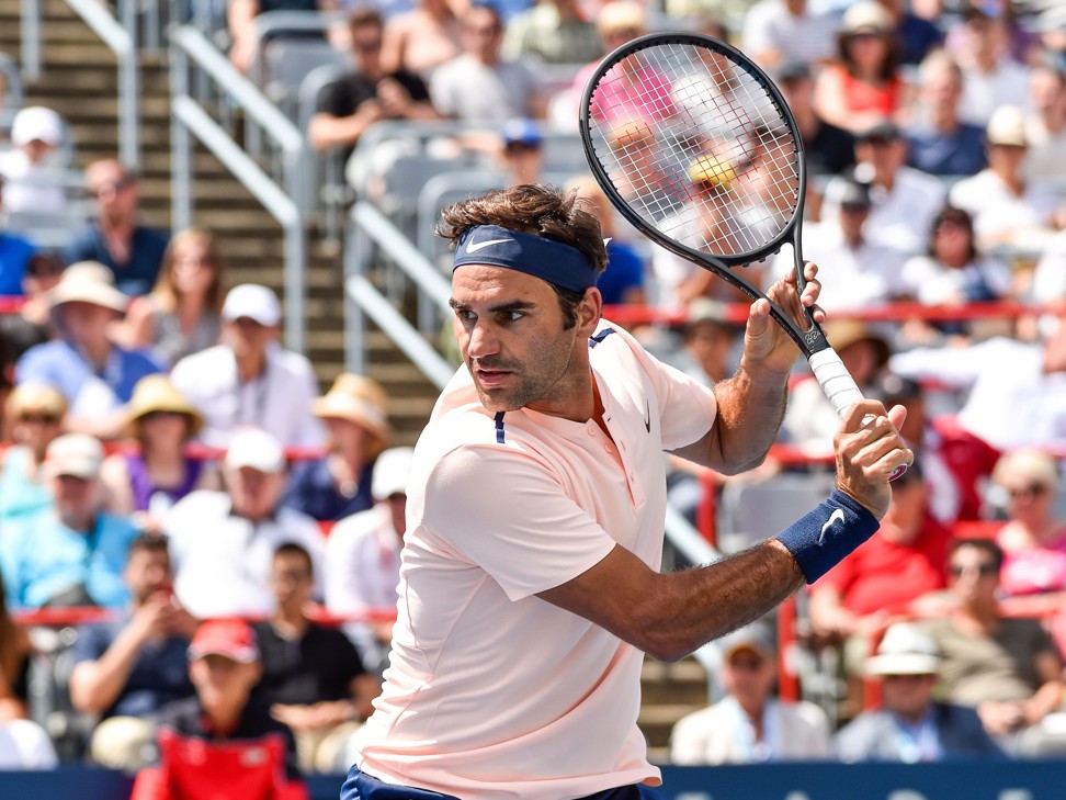 Federer prepares to return the ball against Polansky. Photo: AFP