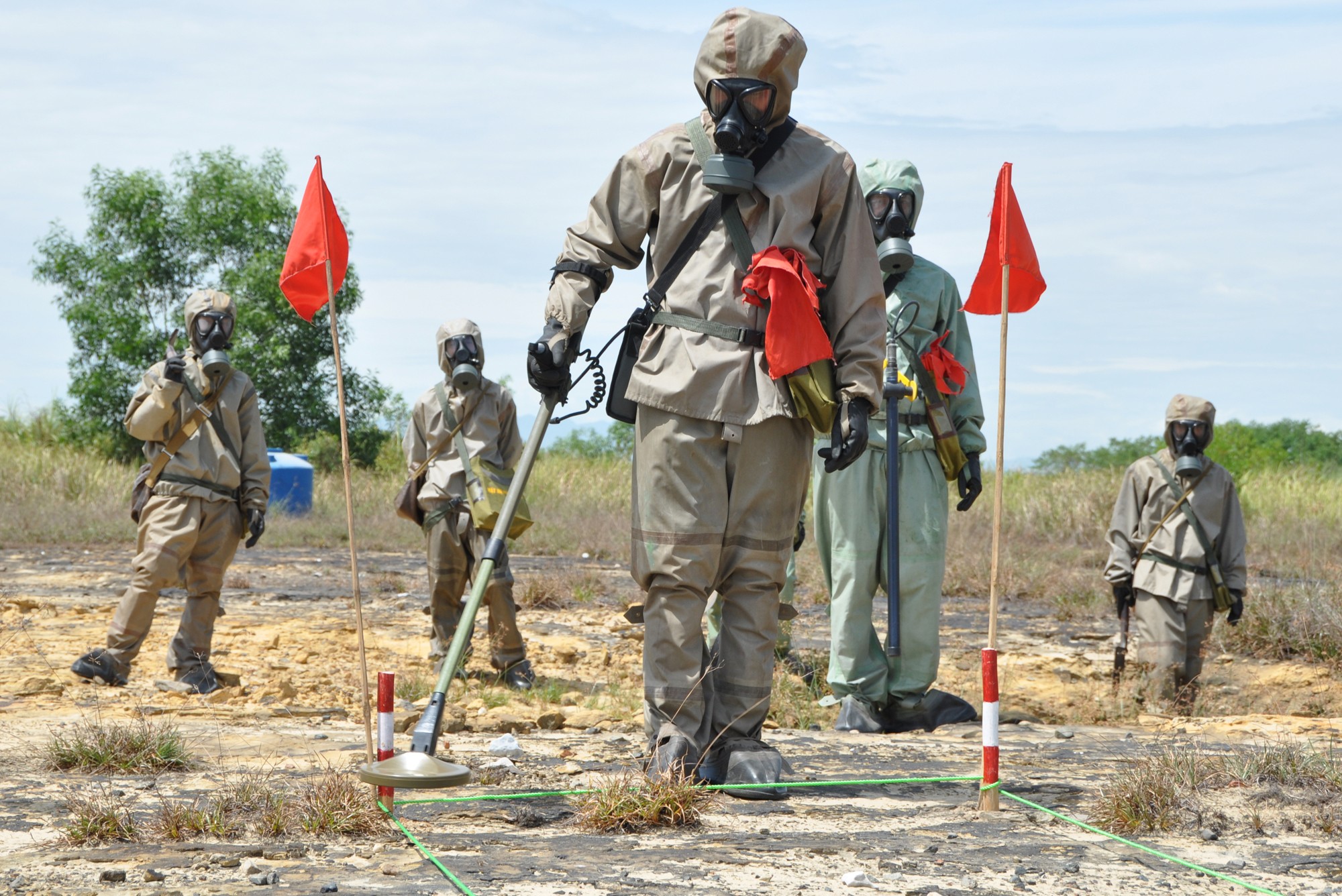 Soldiers in protective gear search for unexploded ordnance at the central Vietnamese city of Danang’s airport. Photo: AFP
