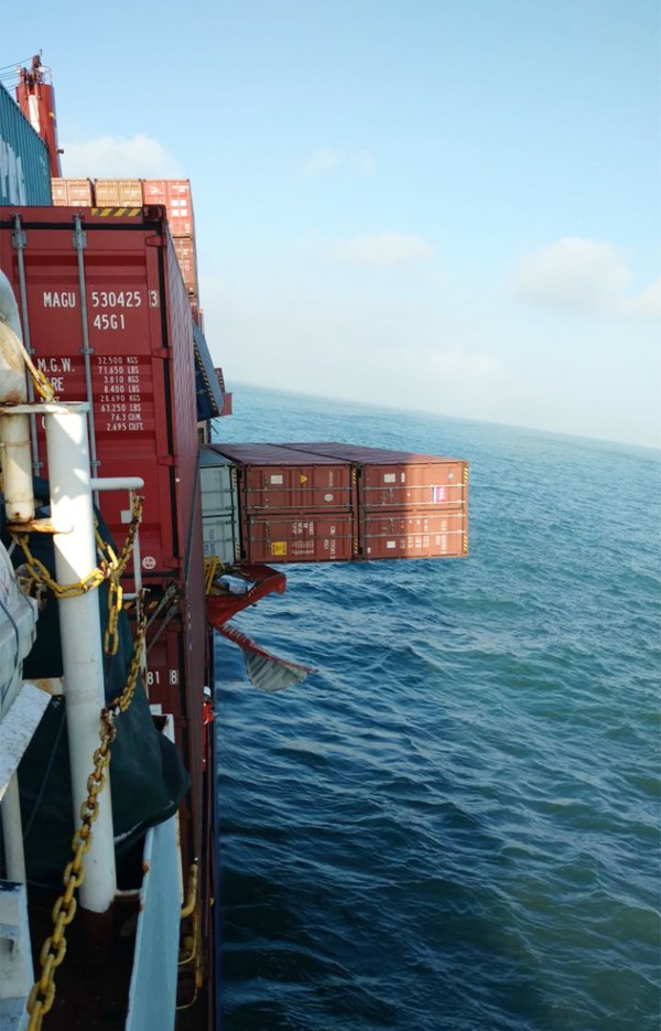Containers hanging over the side of the Brazilian cargo ship Log-In Pantanal. Photo: AFP