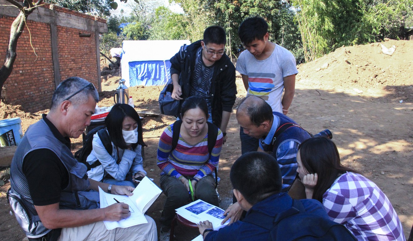 The Chinese University team holds discussions in Guangming village. Photo: Handout