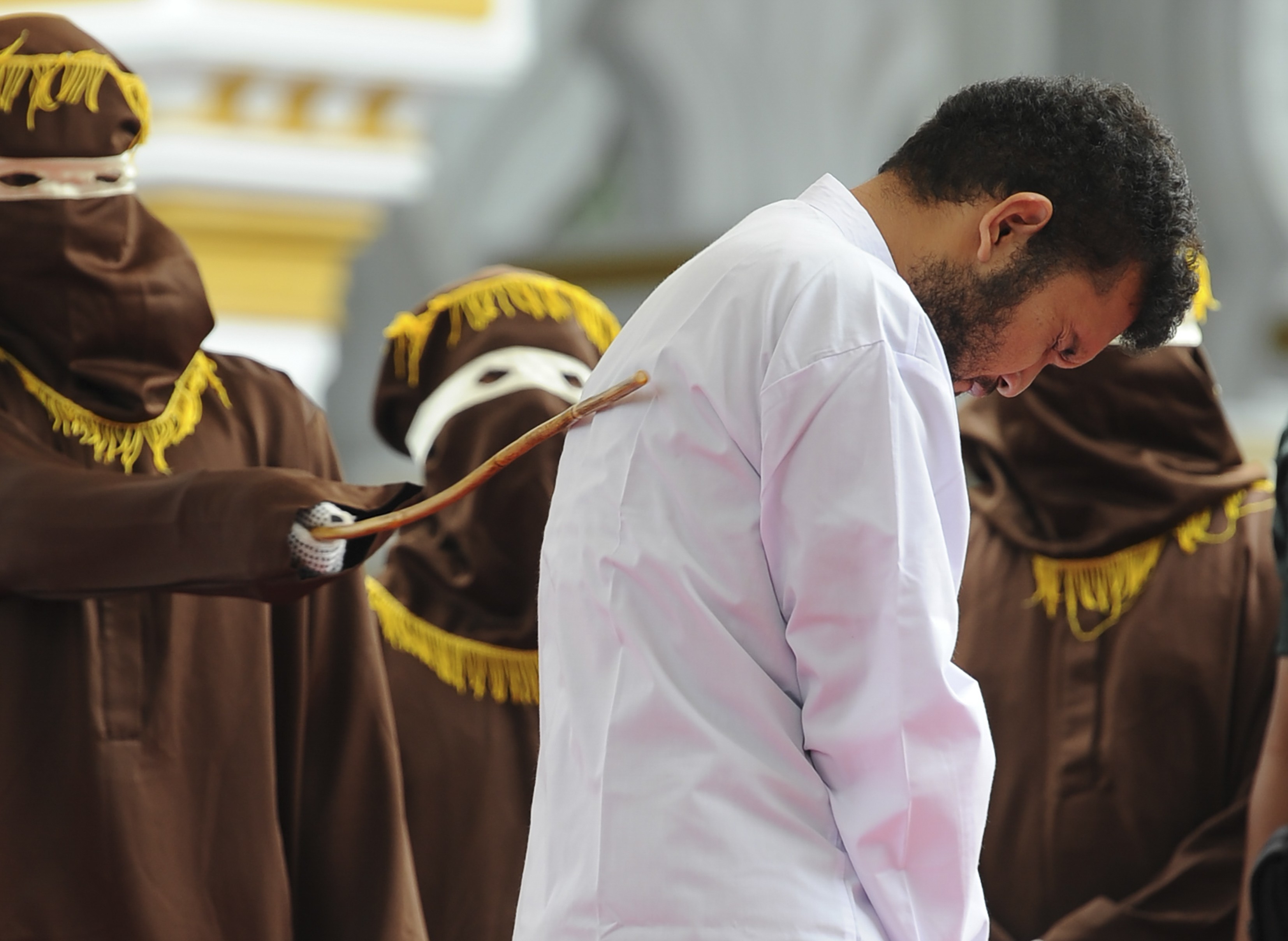 One of two Indonesian gay men is publicly caned for having sex, in a first for the Muslim-majority country where there are concerns over mounting hostility towards the gay community. Photo: AFP