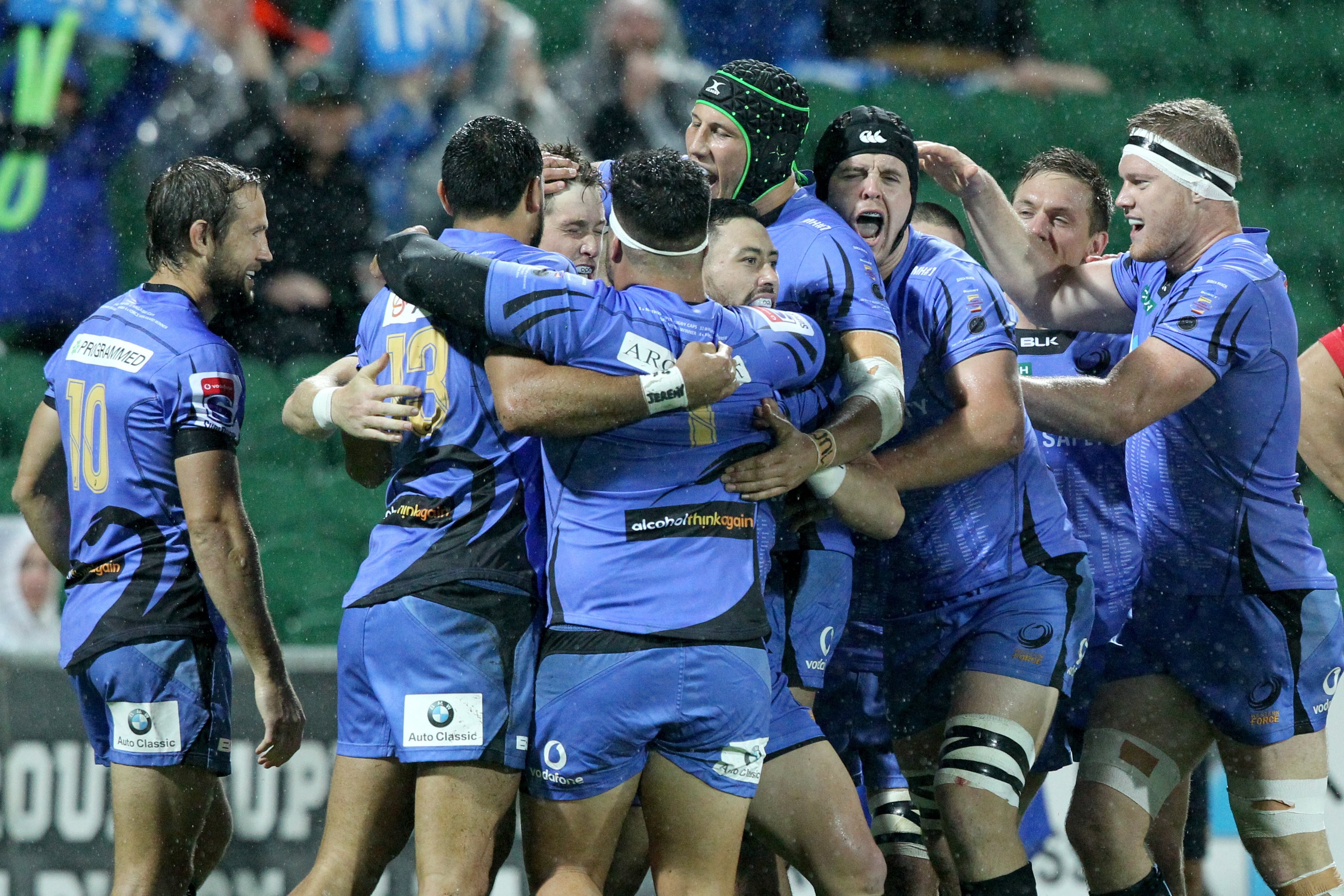 Western Force players celebrate a try. Photo: EPA