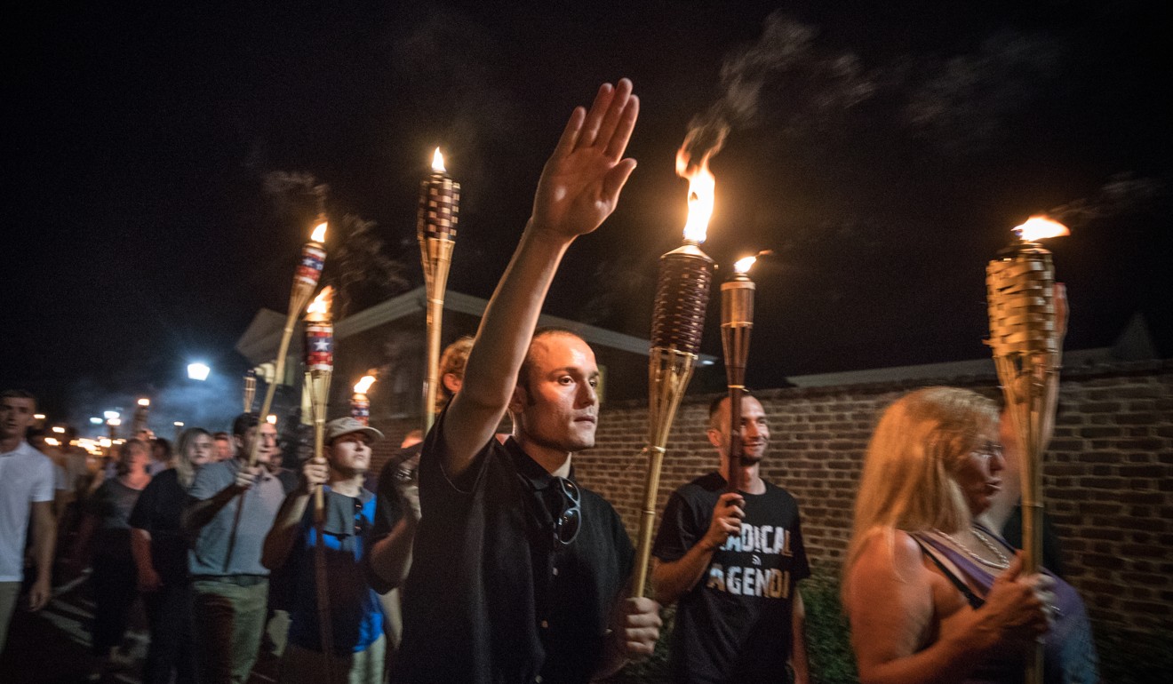 Several hundred white nationalists and white supremacists carrying torches march in a parade through the University of Virginia campus on Friday. Photo: The Washington Post.