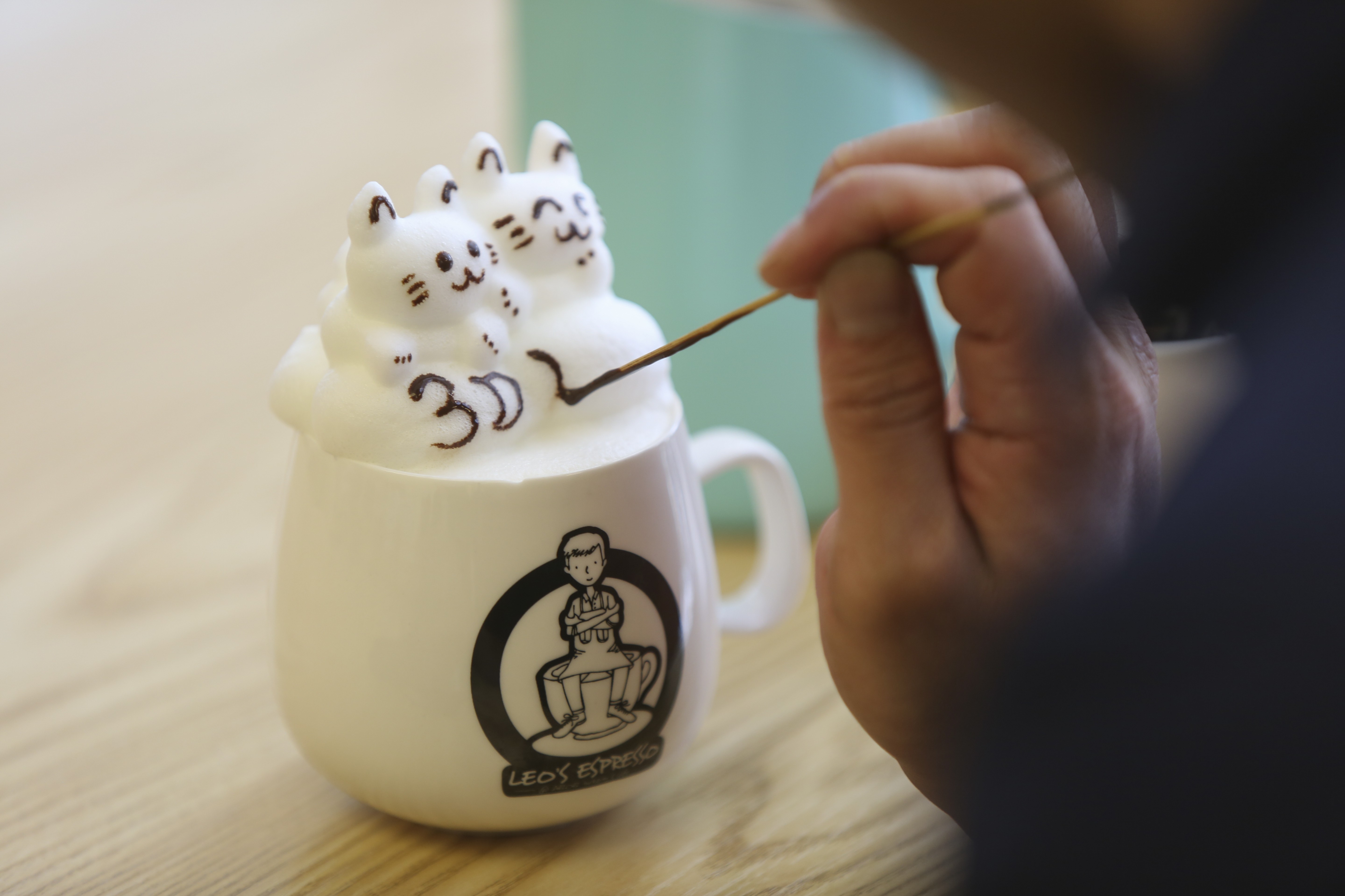 Leo Chau creates 3D latte kittens at his cafe in Admiralty. Photo: Xiaomei Chen