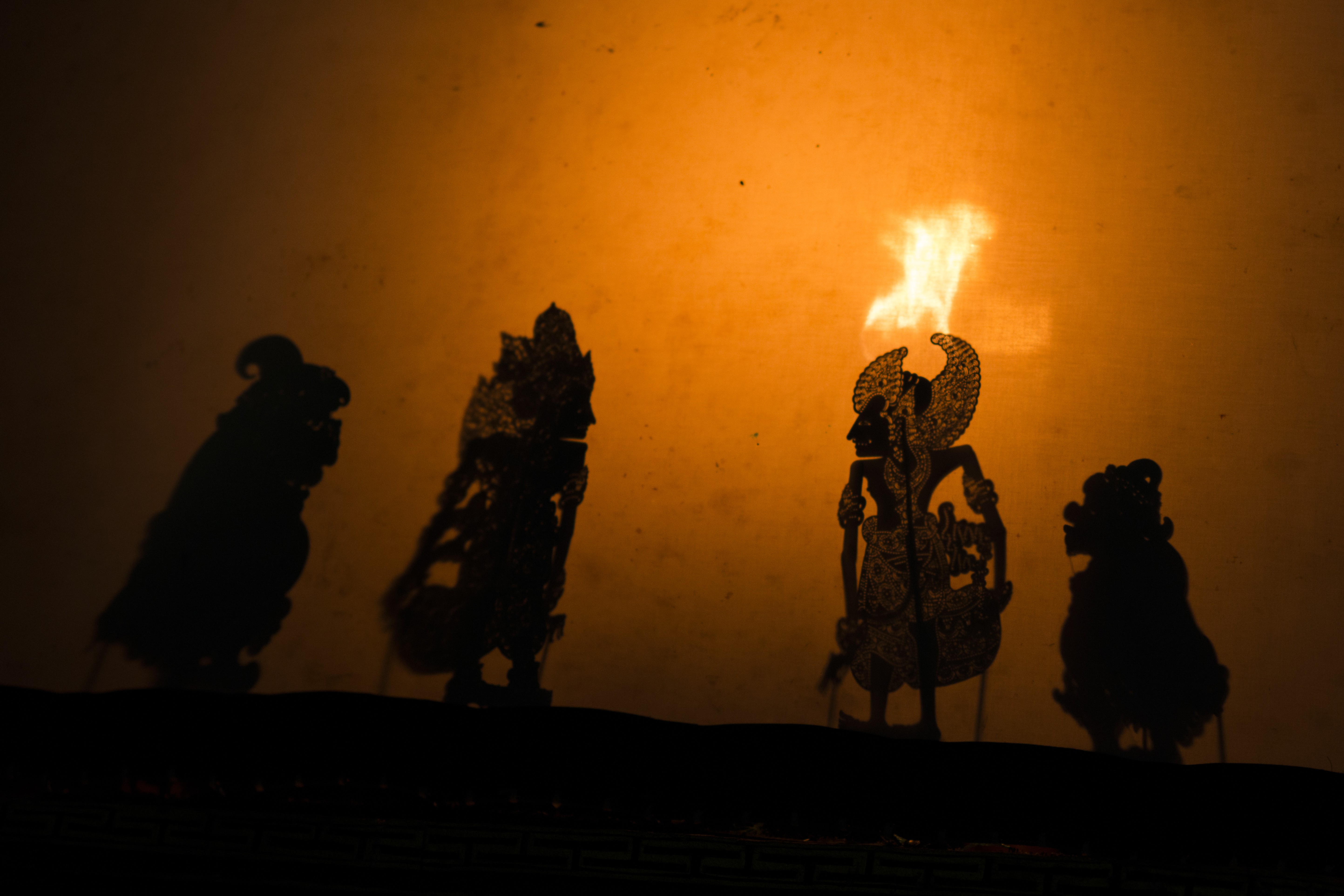 Many authentic Bali shadow puppet performances use firelight for illumination behind the screen. Photo: David Burden