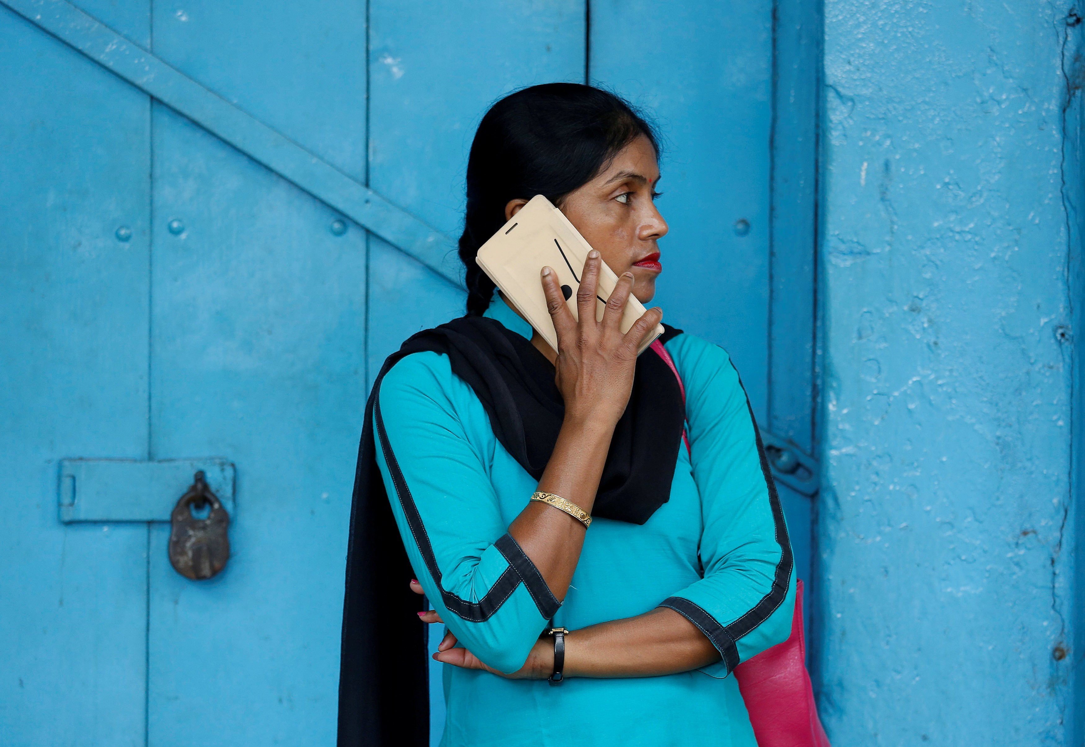 A woman in Kolkata, India makes a mobile phone call. The market is increasingly dominated by Chinese manufacturers. Photo: Reuters