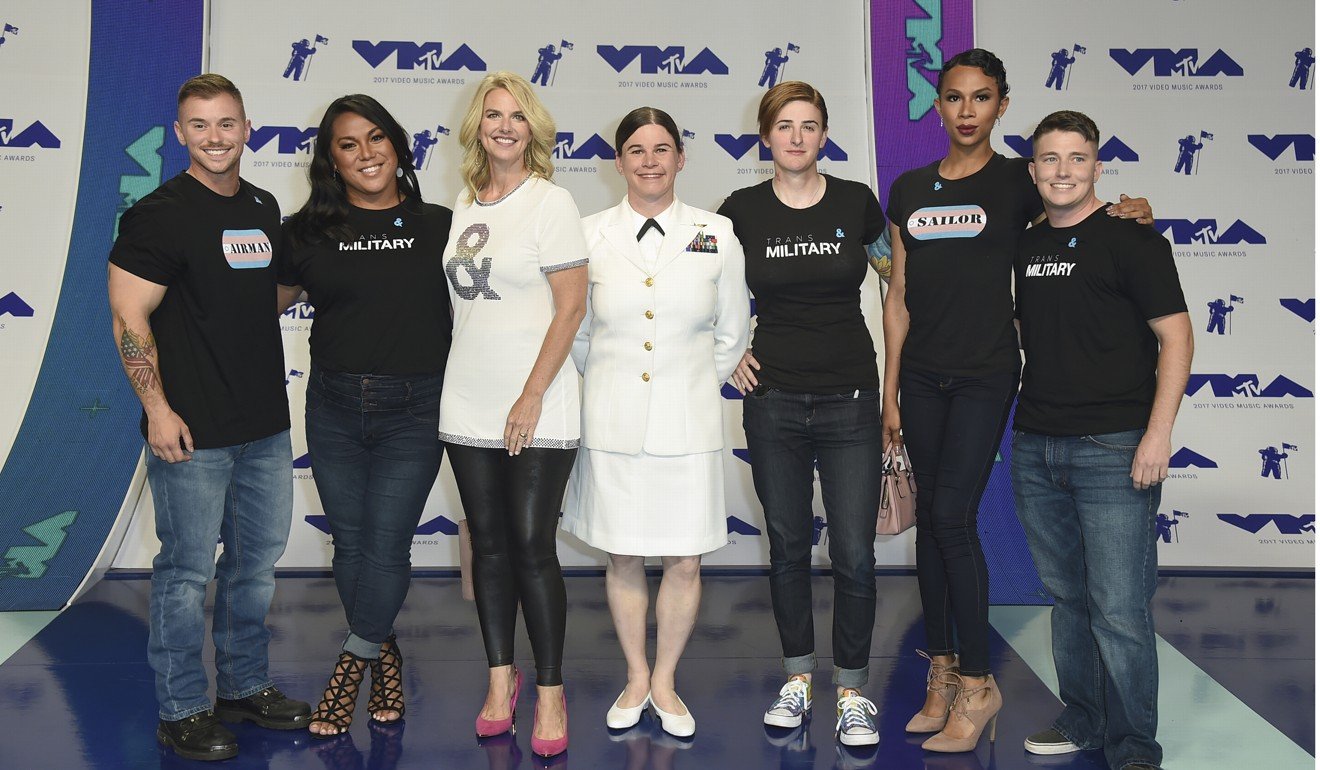 Sarah Kate Ellis, GLADD president and CEO, third from left, and transgender service members arrive at the MTV Video Music Awards. Photo: AP