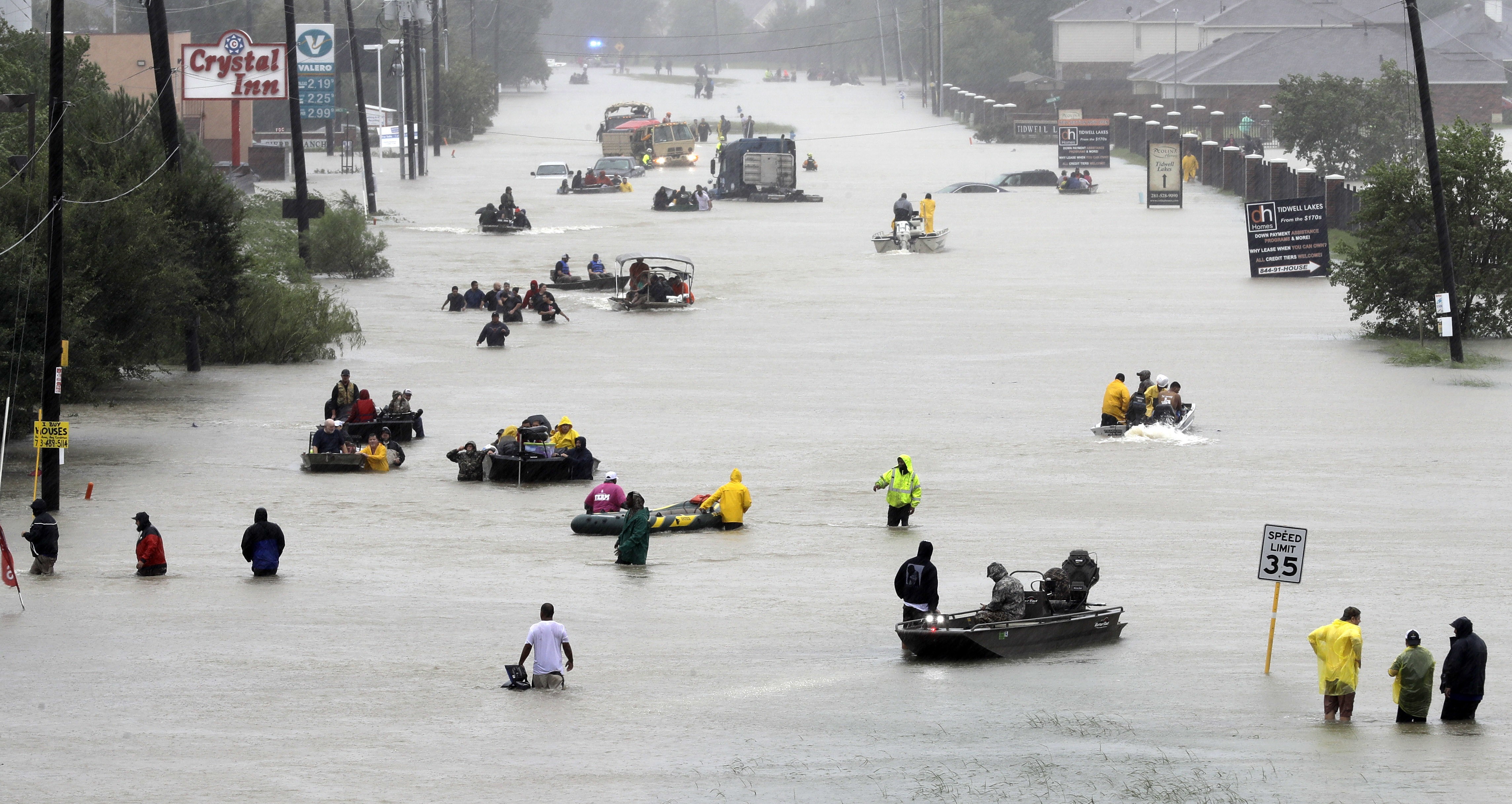 Rescue boats fill a flooded street in Houston, Texas. Photo: AP