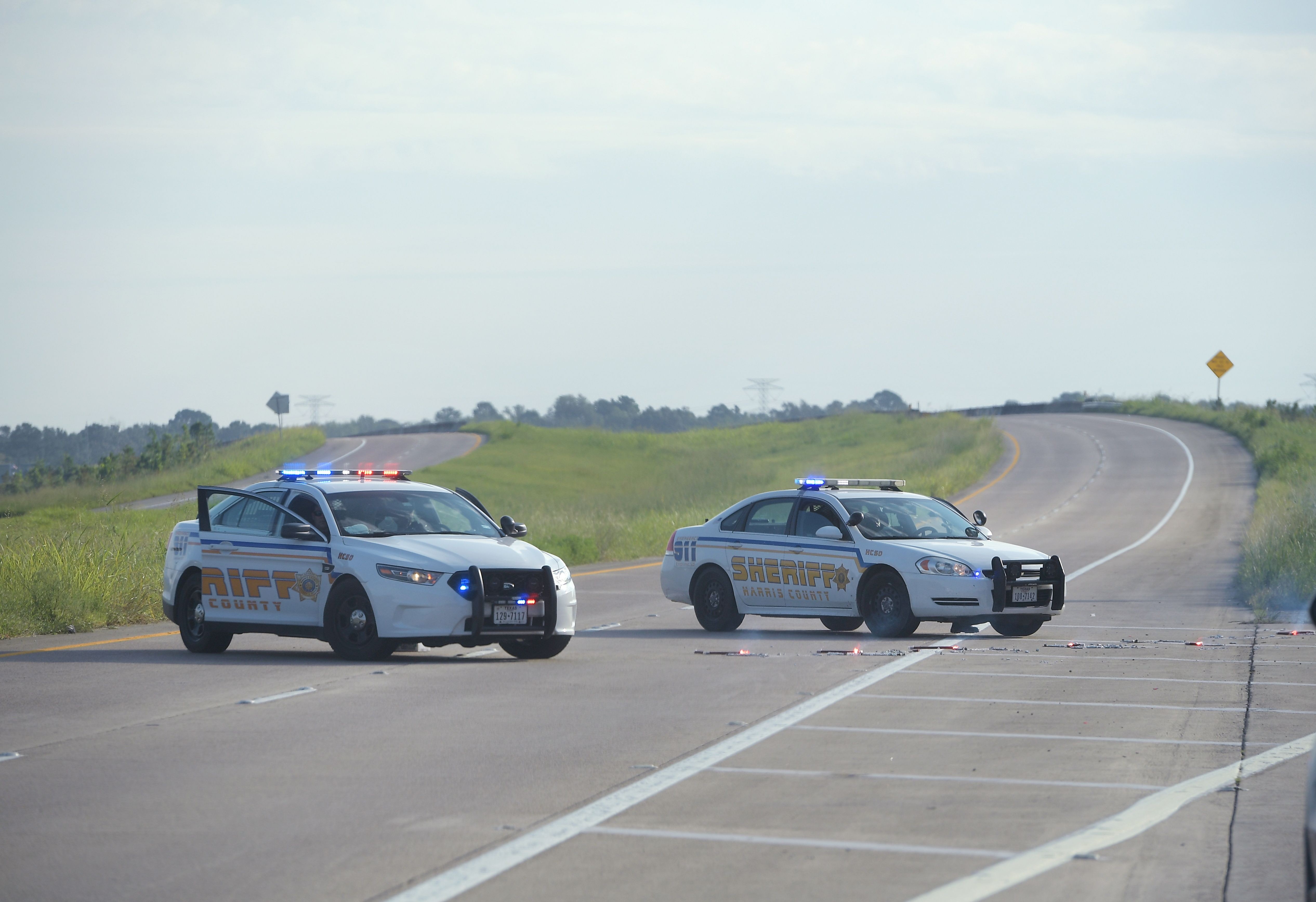 Harris County Sheriff vehicles block the road to the Arkema Chemical Plant in Crosby, Texas. Photo: AFP