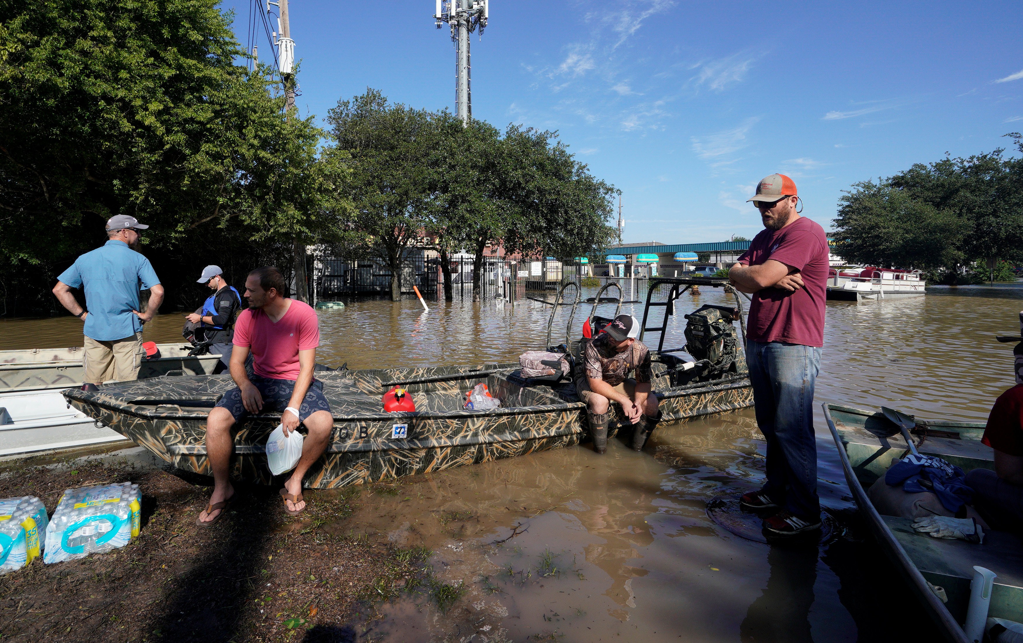 The sun finally came out as floodwaters recede as volunteers with boats wait to evacuate victims stuck in Tropical Storm Harvey’s floodwaters in western Houston. Photo: Reuters