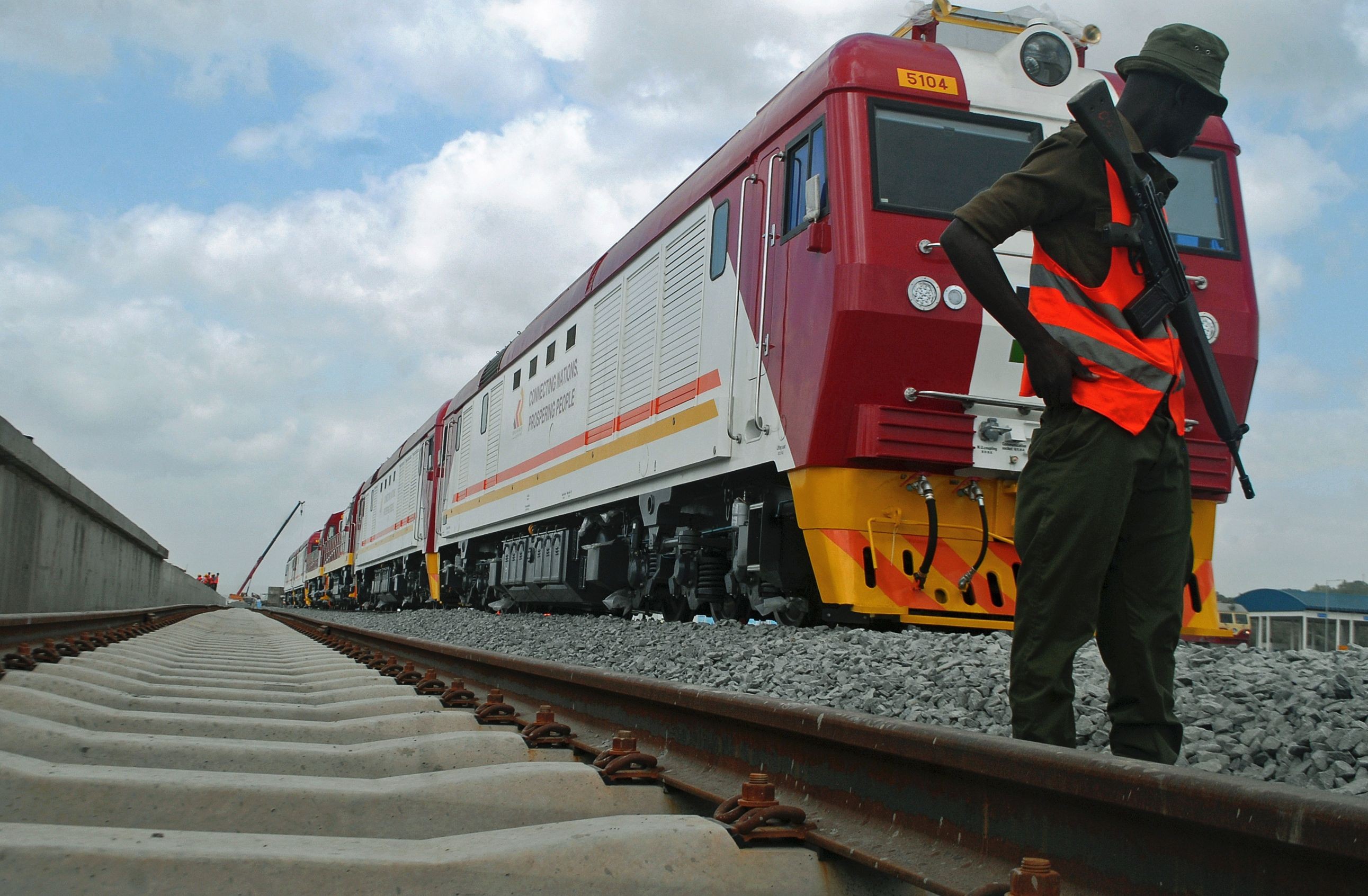 A security guard patrols during the launch of the first batch of Standard Gauge Railway (SGR) freight locomotives at the port in Mombasa last January. The SGR system, the biggest infrastructure project in Kenya since independence, is being built by the state-owned China Road and Bridge Corporation, with plans to connect Kenya, Uganda, Rwanda and South Sudan to Mombasa. Photo: AFP
