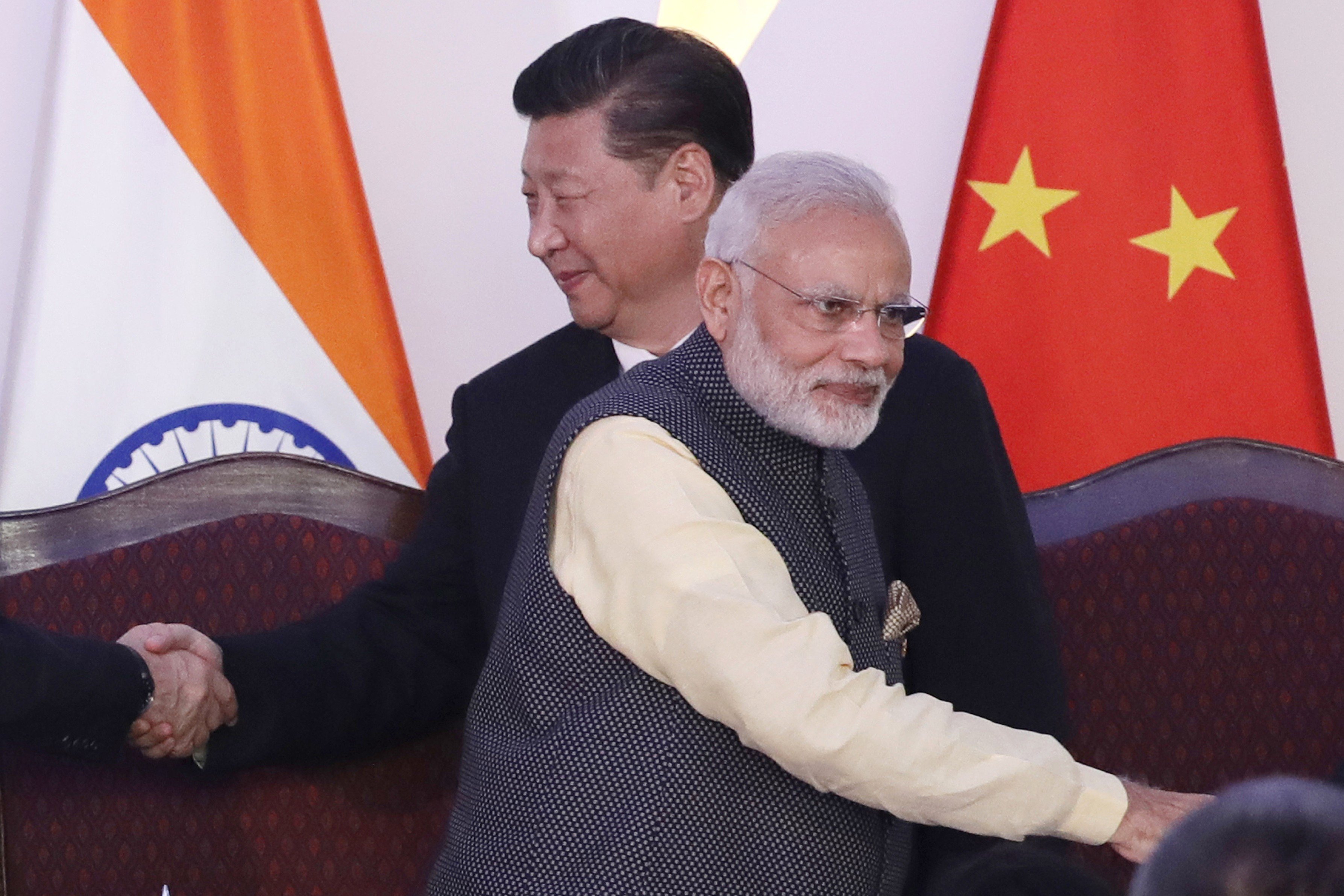Chinese President Xi Jinping (left) and Indian Prime Minister Narendra Modi shake hands with leaders at last year’s BRICS summit in Goa. The pair last met on the sidelines of the G20 in Hamburg. Photo: AP