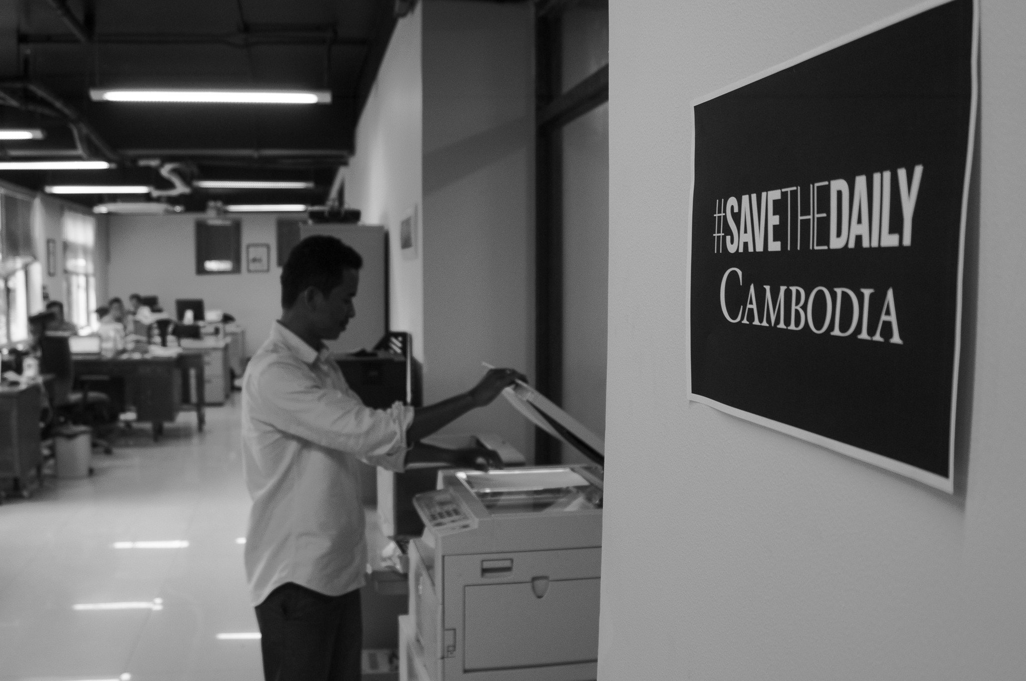 Chansy Chhorn, The Cambodia Daily’s news editor, photocopying in the offices. Photo: Nathan A. Thompson
