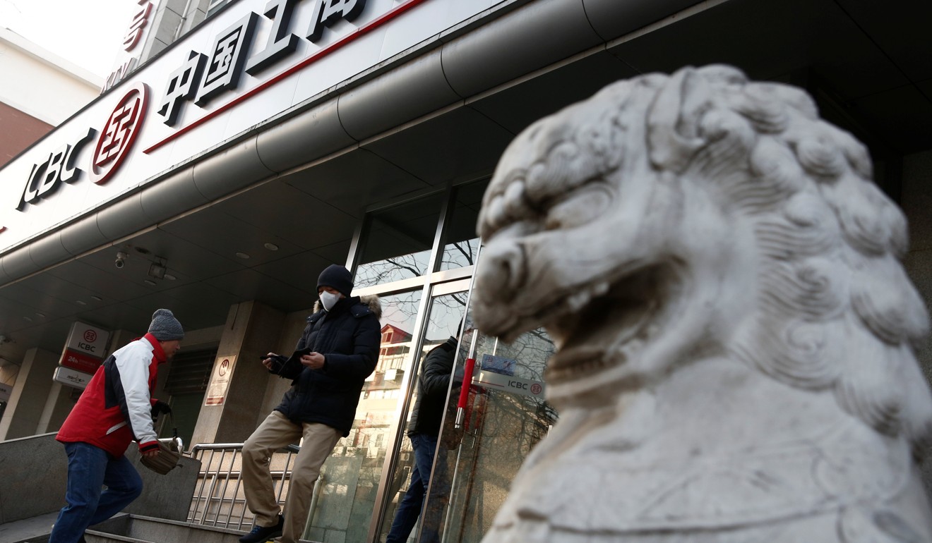 People enter a branch of the ICBC bank in Beijing, China. Photo: Reuters