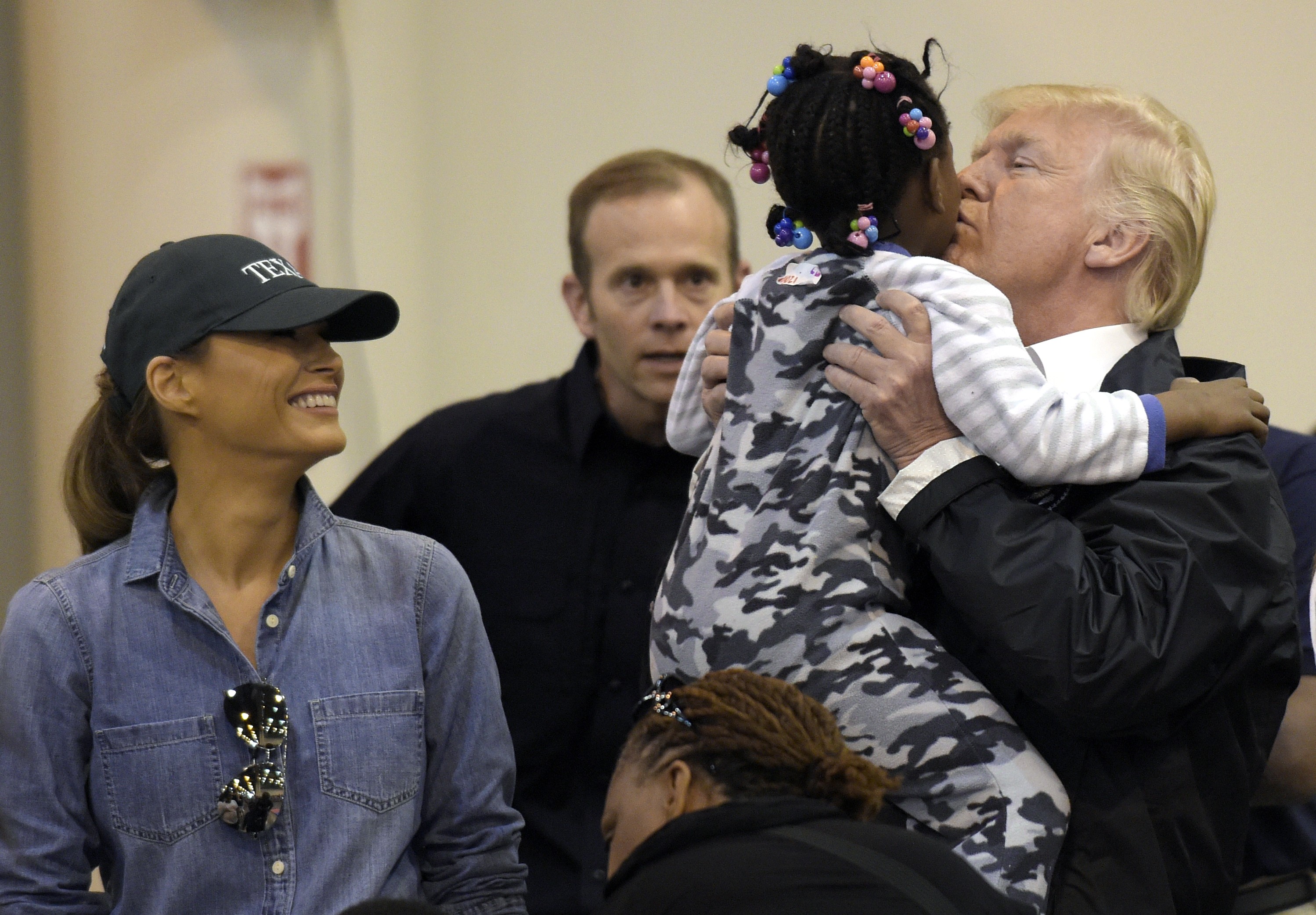 US President Donald Trump and Melania Trump meet people impacted by Hurricane Harvey during a visit to the NRG Centre in Houston. Photo: AP