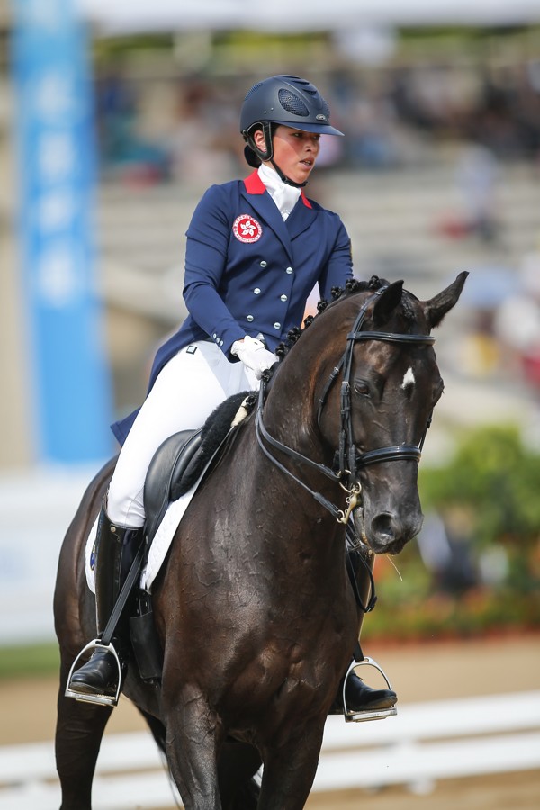 Jacqueline Siu and Jockey Club Fuerst on Tour compete in the dressage final,