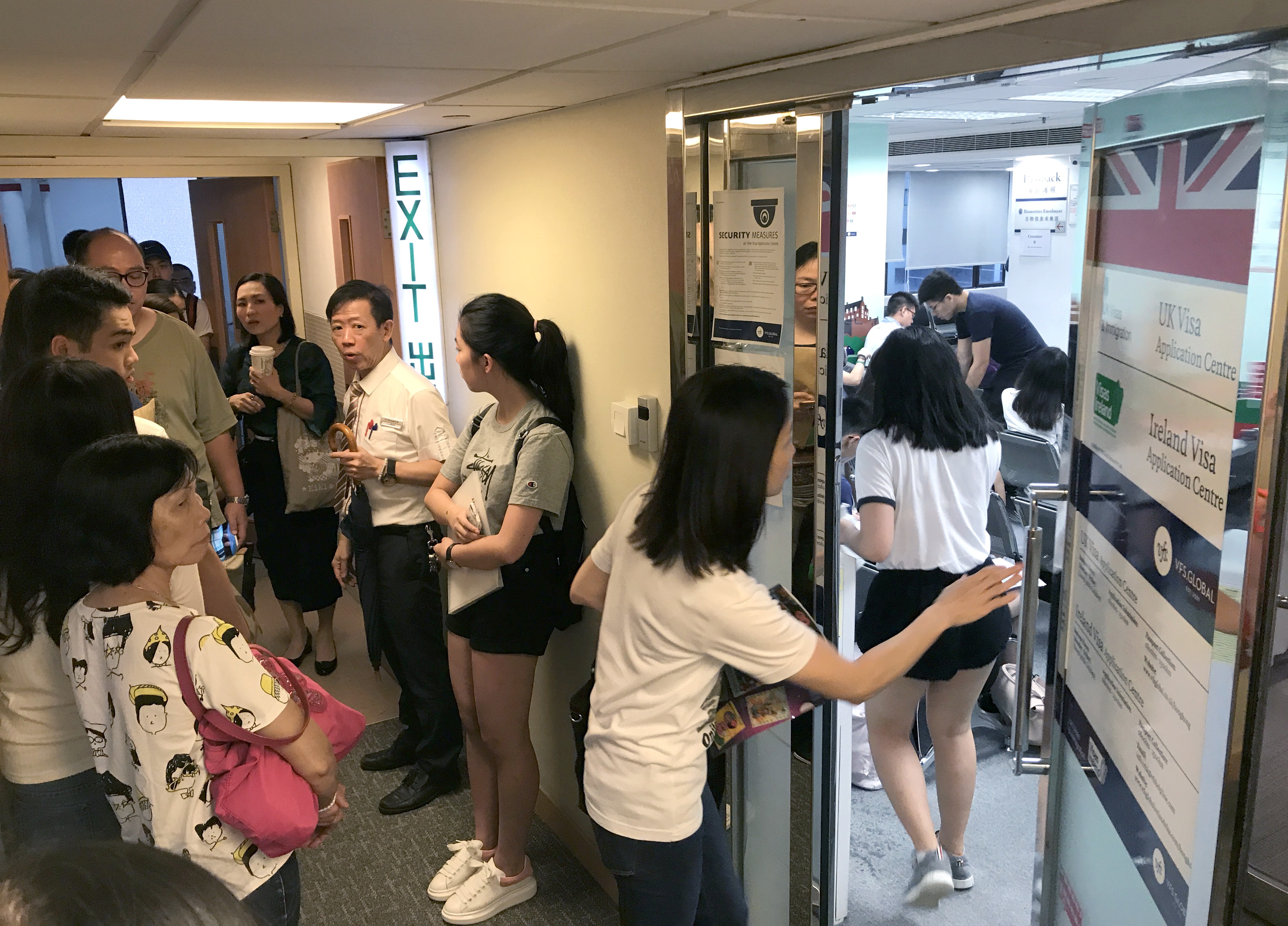 Anxious visa applicants and their families queued up at the British visa centre in Causeway Bay on Monday. Photo: Nora Tam