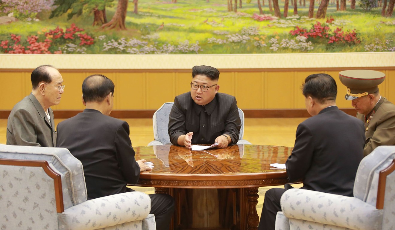 A photo taken on Sunday shows North Korean leader Kim Jong-Un (centre) attending a meeting with officials about North Korea’s latest nuclear test, conducted that day. Photo: AFP