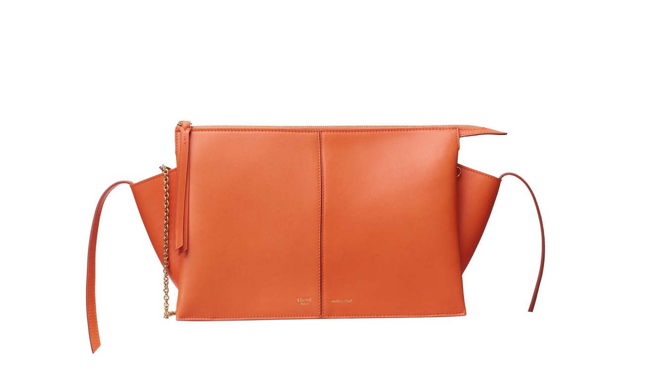 The orange calfskin bag brightens up your look and is big enough to hold all your summer necessities.