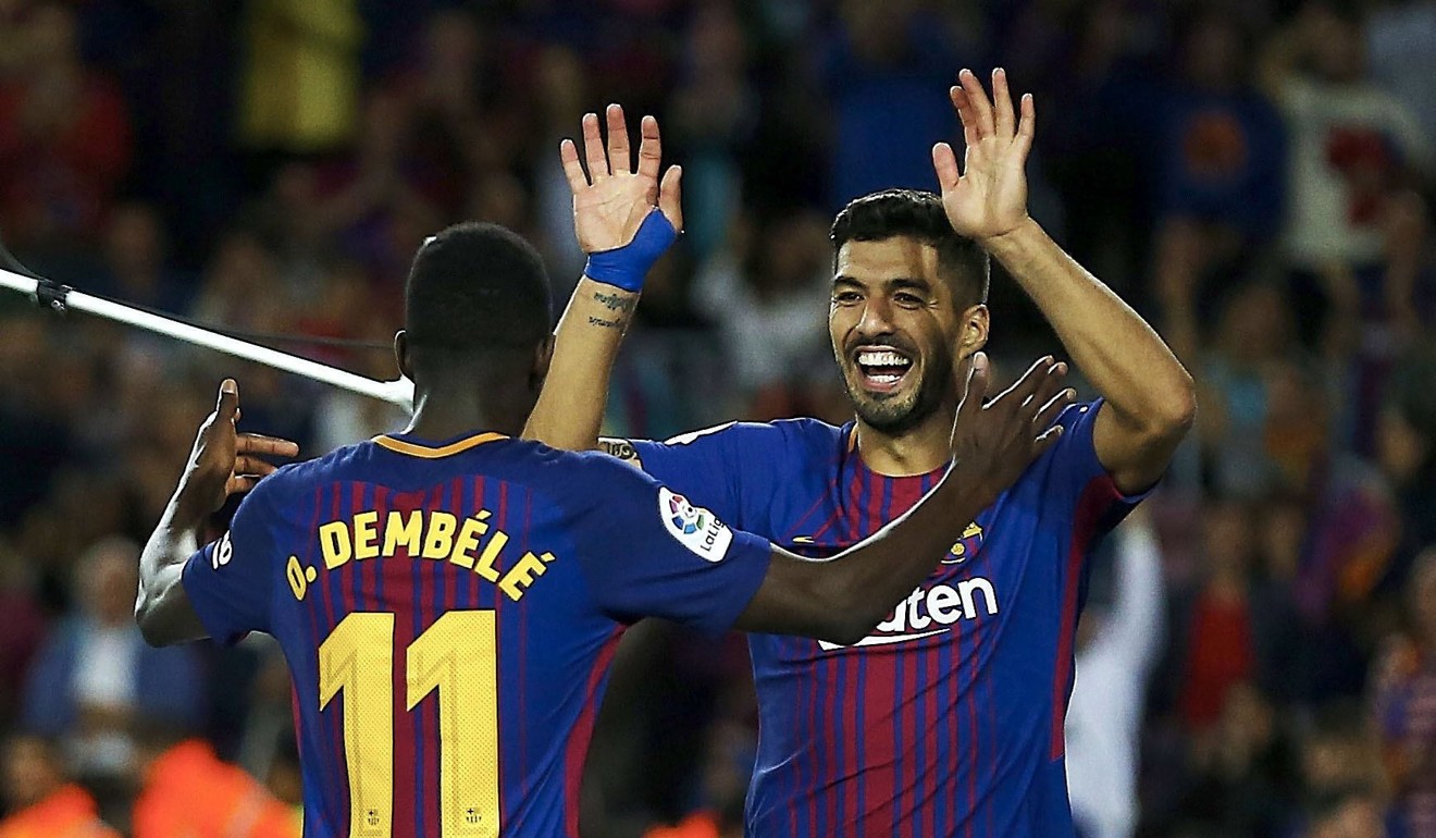 Ousmane Dembele (left) bagged an assist for Barcelona on his debut. Photo: EPA