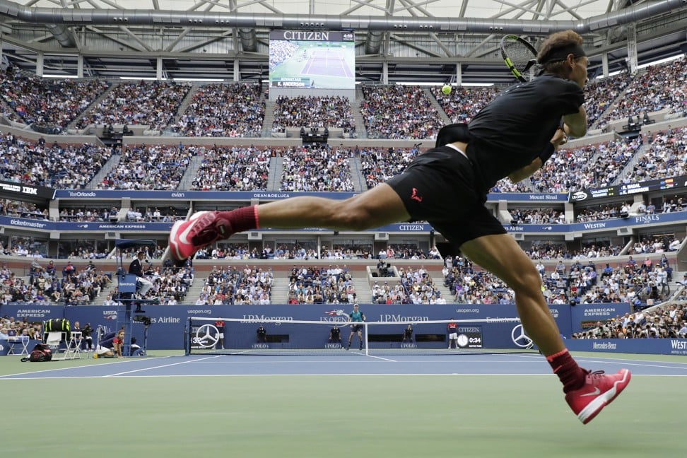 Nadal of Spain hits a return to Anderson during their US Open final. Photo: EPA