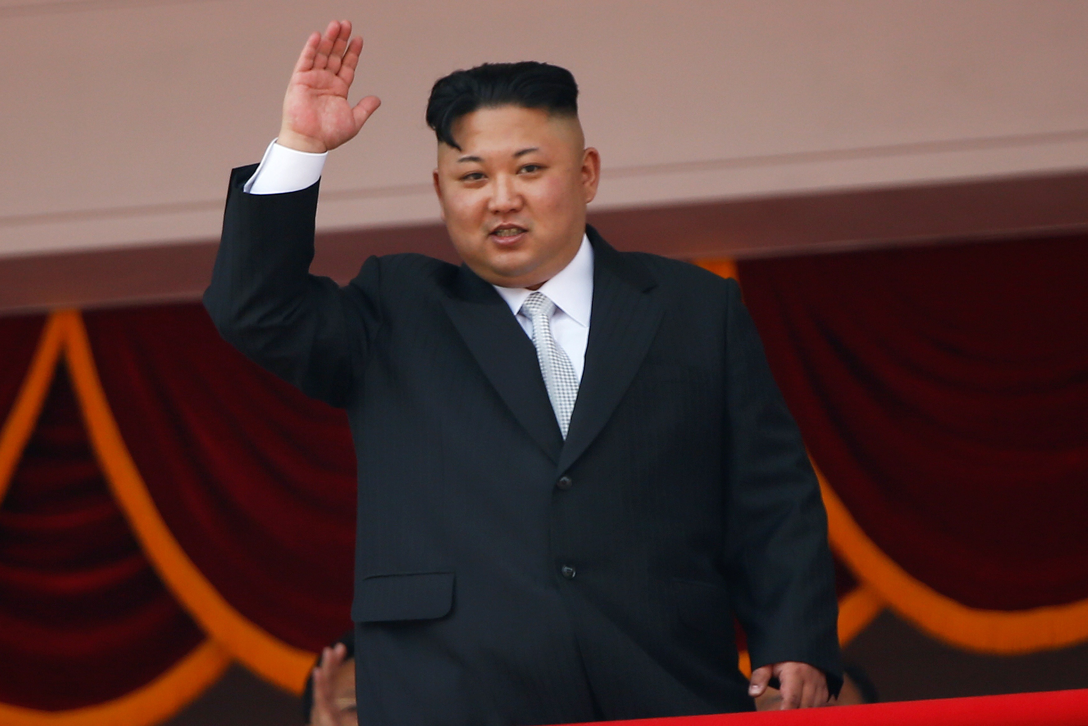 North Korean leader Kim Jong-un waves to people attending a military parade marking the 105th birthday of the country’s founding father, Kim Il-sung, in Pyongyang on April 15. Photo: Reuters