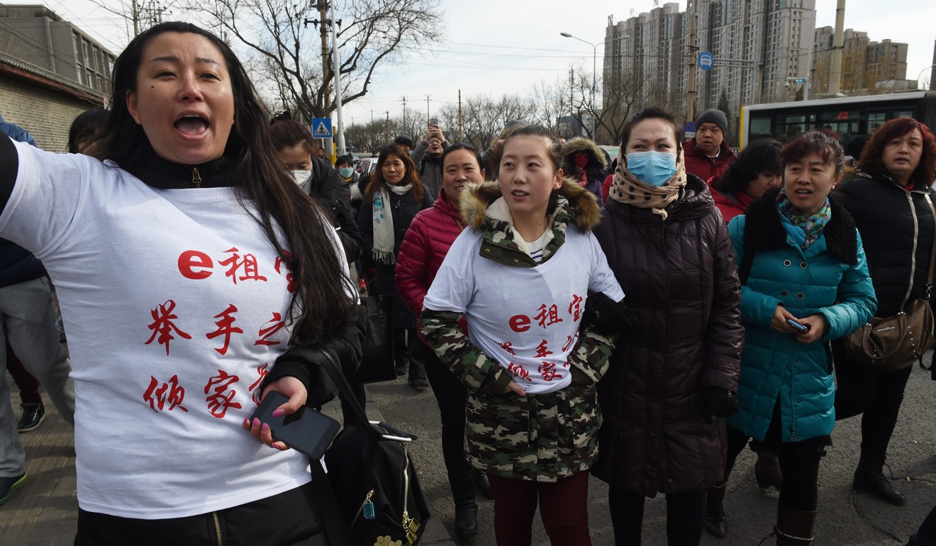 Ezubao investors protest in Beijing in February last year after the collapse of the scheme. Photo: AFP