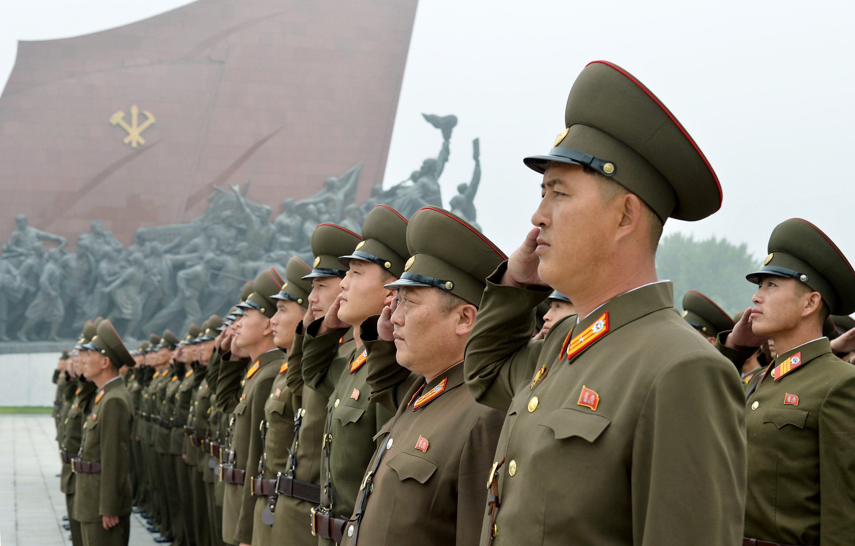 North Korean soldiers salute at Munsu Hill in Pyongyang on Saturday to mark the 69th anniversary of the country's founding. Photo: Kyodo News via AP
