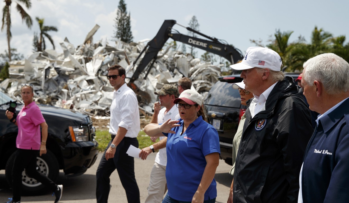 President Donald Trump, first lady Melania Trump and vice-president Mike Pence, right, tour Naples Estates, a neighbourhood damaged by Hurricane Irma on Thursday, September 14, 2017, in Naples, Florida. Photo: AP