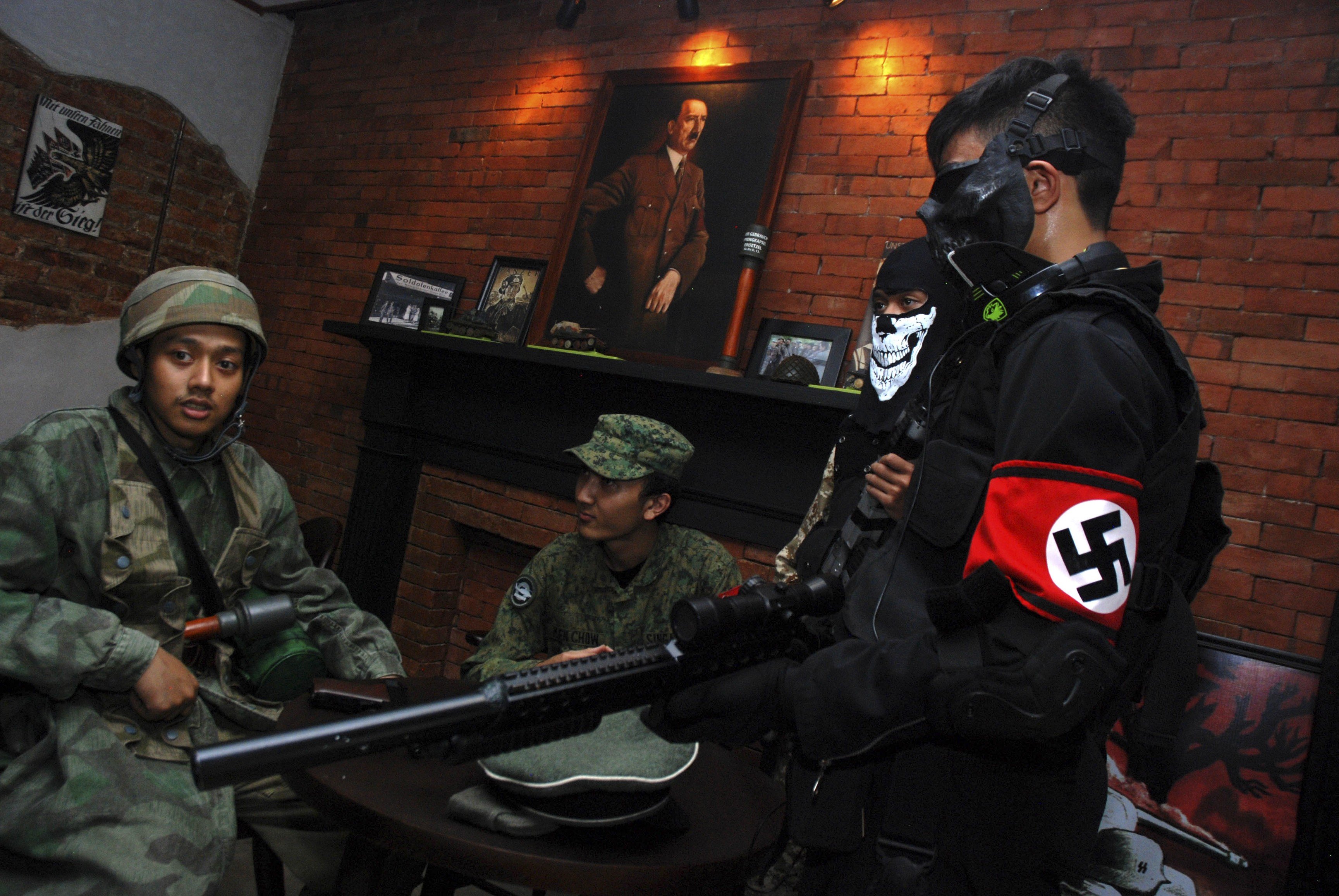 Indonesian customers in second world war military uniforms at Soldatenkaffee in Bandung before the cafe was closed down for a second time in January this year. Photo: AFP