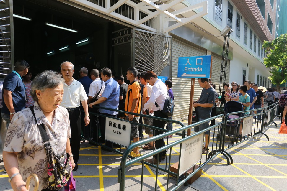 Macau residents queue at the polling station in the morning. Photo: Dickson Lee