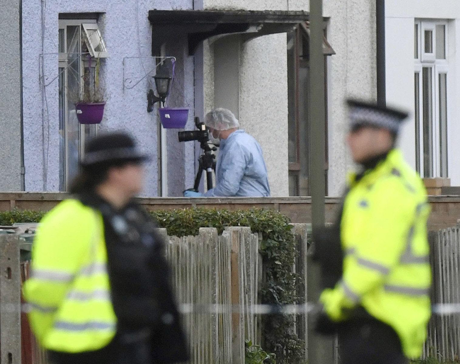 Police and forensic officers work at a property in Sunbury-on-Thames, southwest London, as part of the investigation into Friday's Parsons Green bombing. Photo: AP