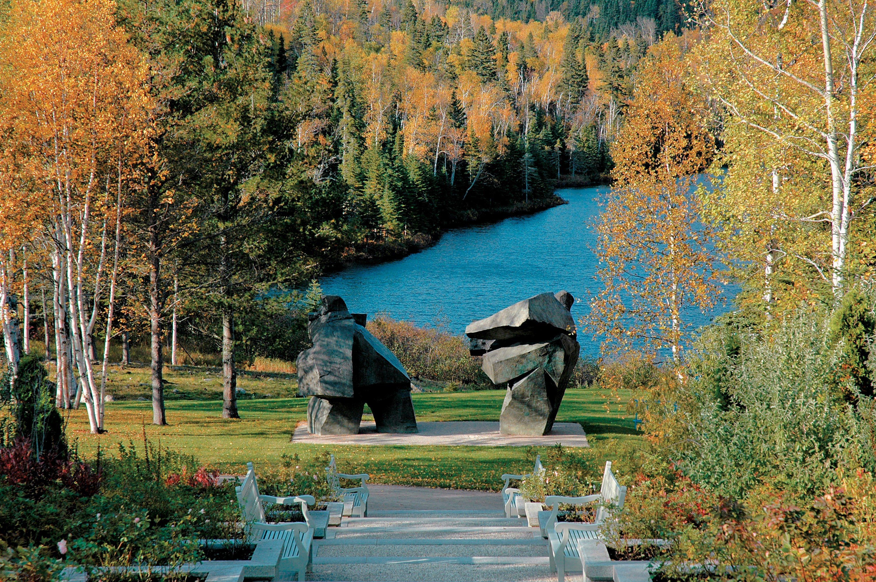 A pair of Ju Ming sculptures doubles up as framing device for a country estate in Quebec. Photo: Handout