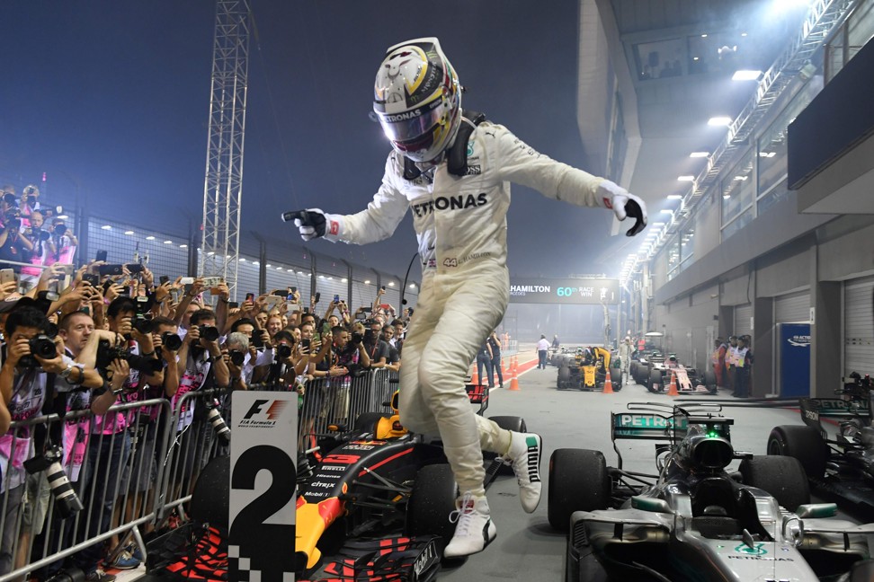 Mercedes’ Lewis Hamilton celebrates winning the Formula One Singapore Grand Prix. Photo: AFP