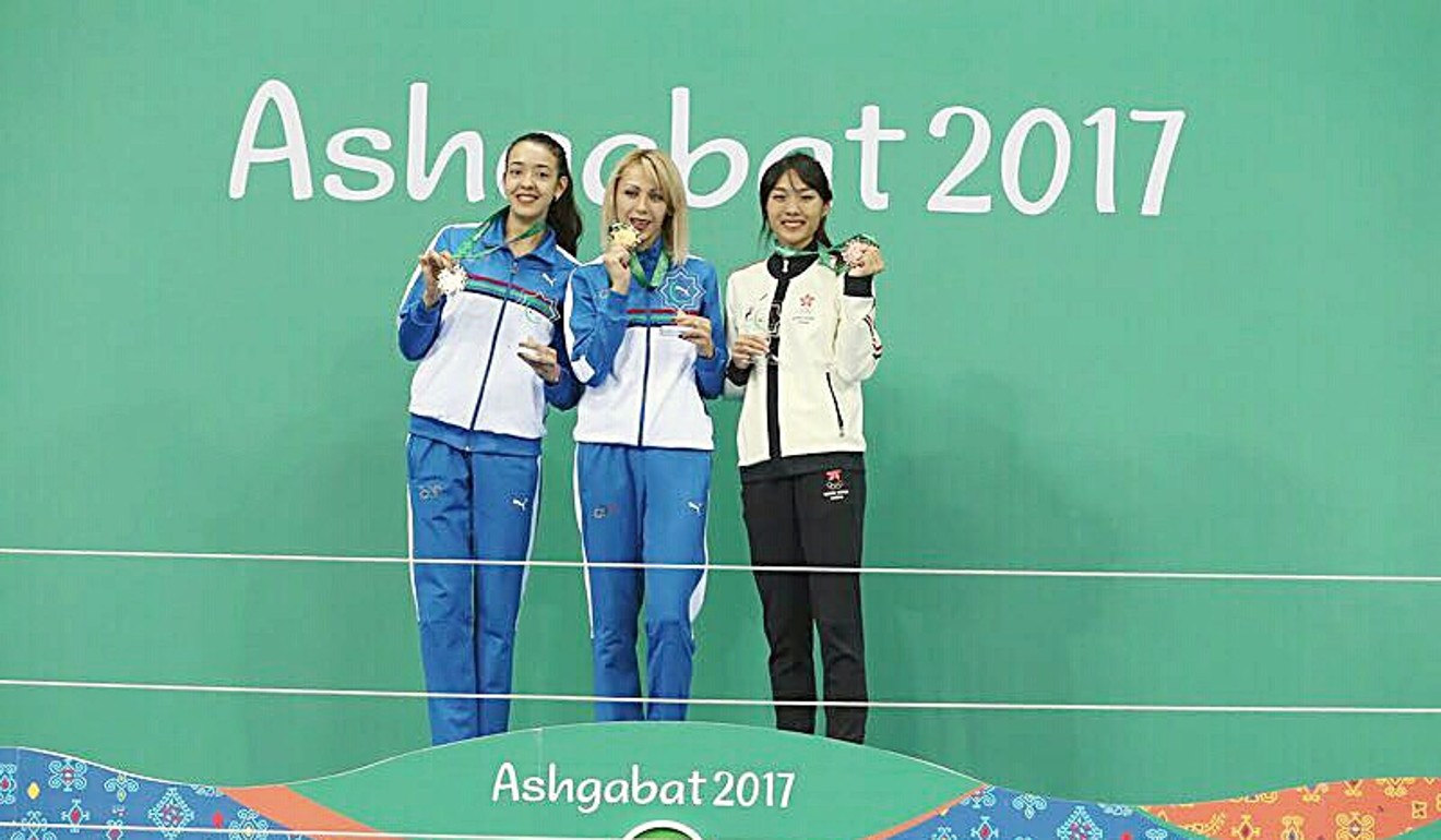 Yeung (right) on the podium.