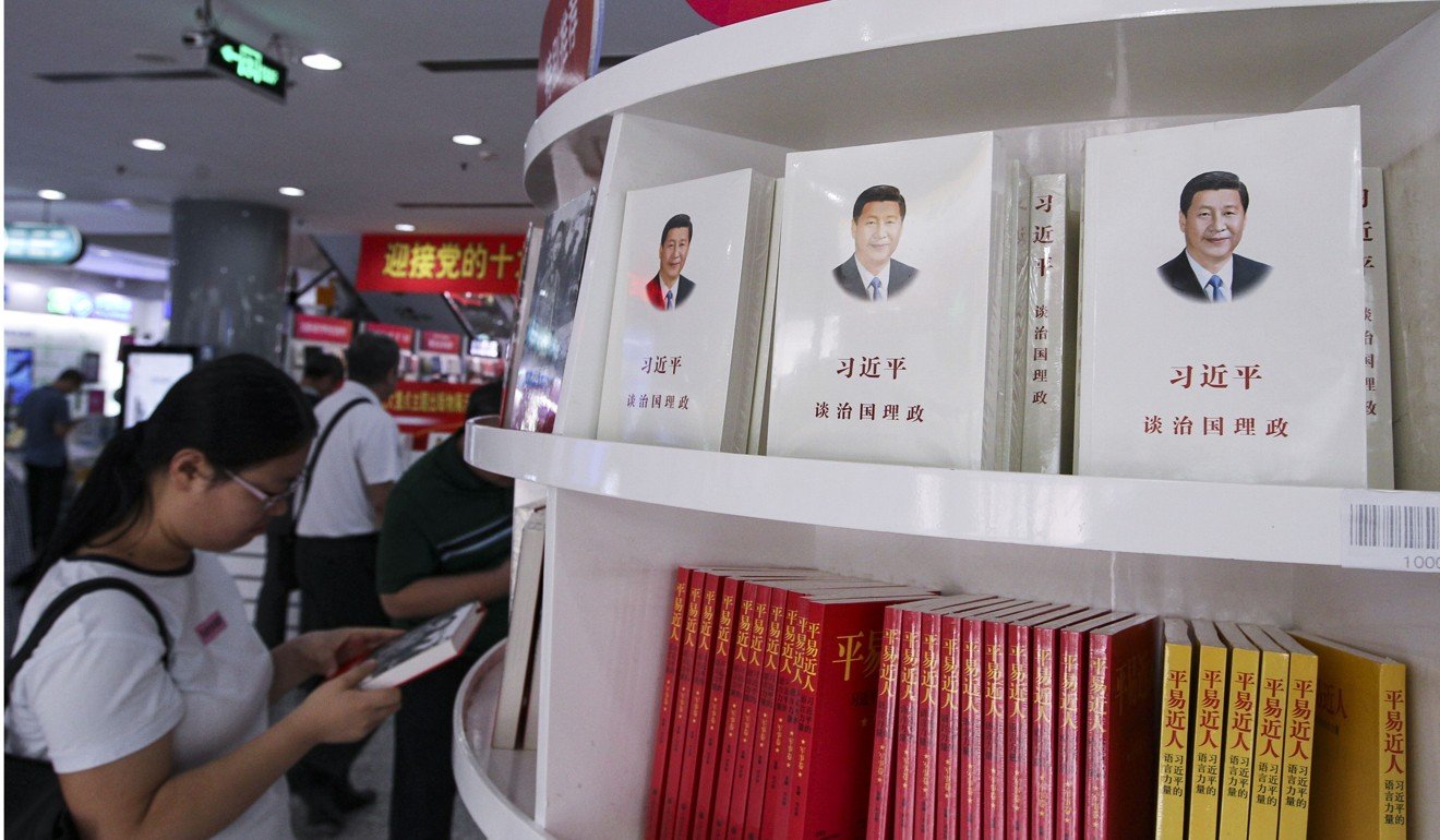 A woman browses books about President Xi Jinping at the Xidan Book Building in Beijing. Xi’s political ideas are set to be added to China’s constitution. Photo: Simon Song