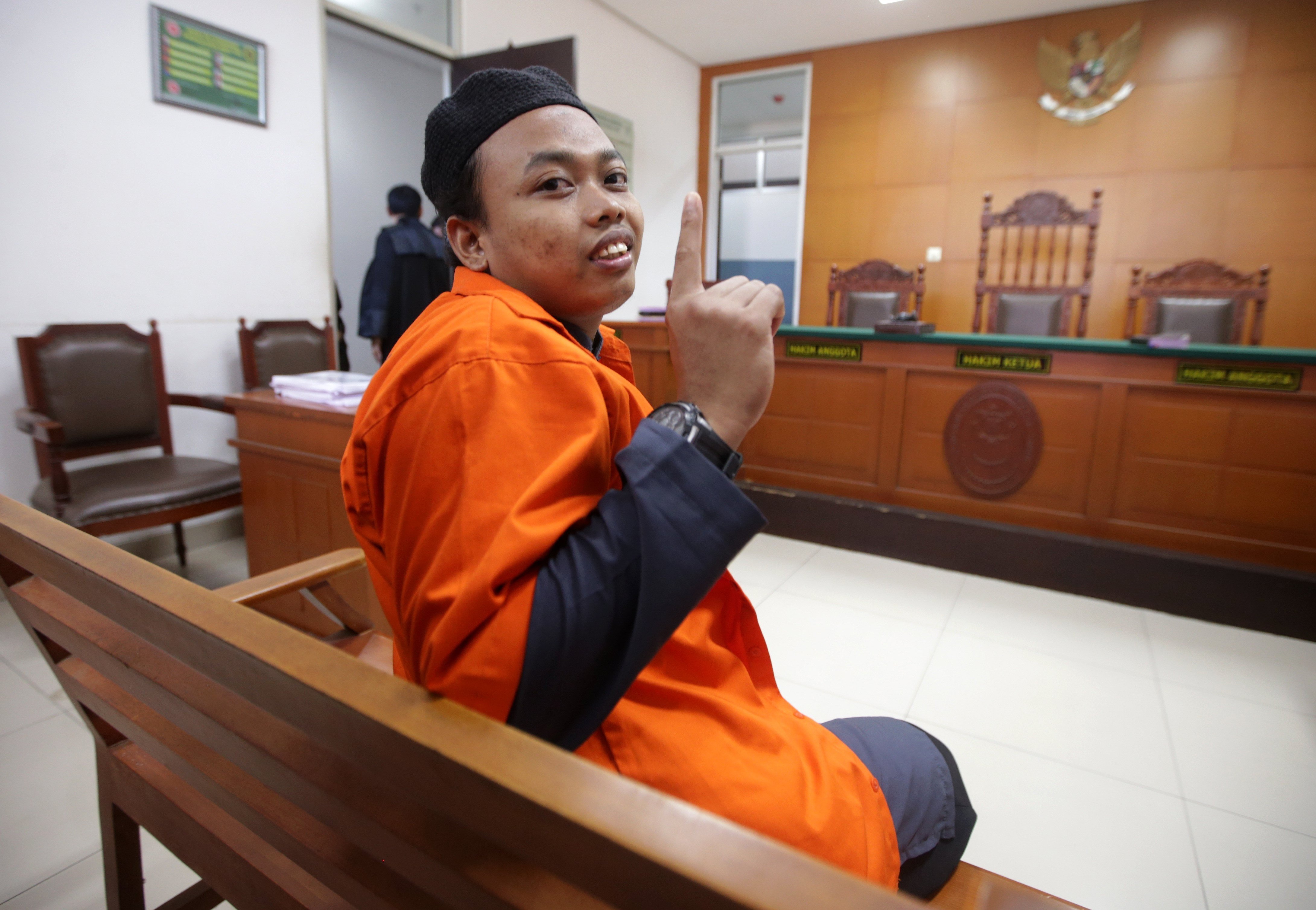 Muhammad Nur Solihin before his trial in Jakarta. Photo: EPA