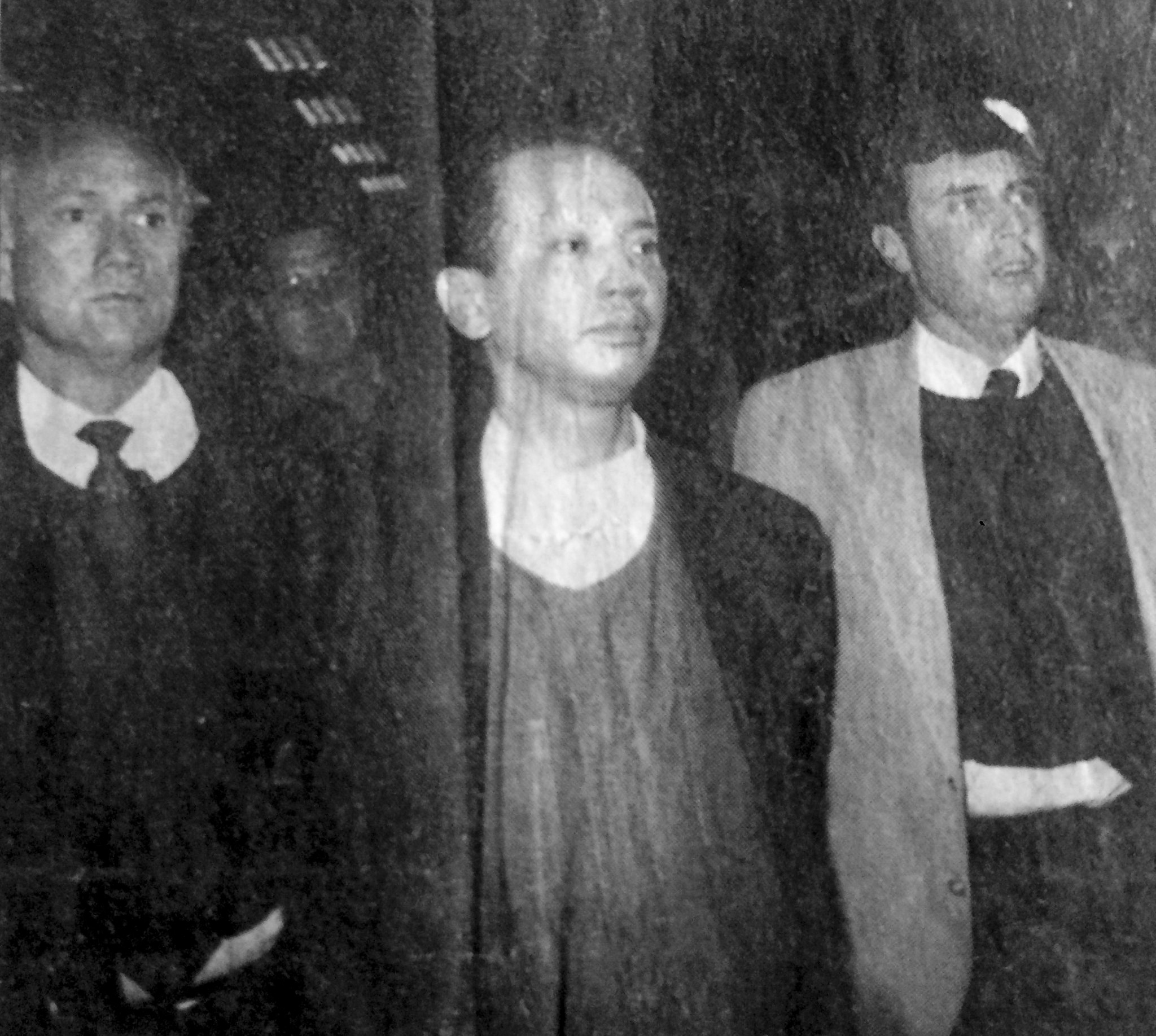 Tony Young, flanked by FBI agents, arrives at LAX airport in 1995, having been arrested by Taiwanese authorities and put on a Los Angeles-bound flight. Picture: Los Angeles Times