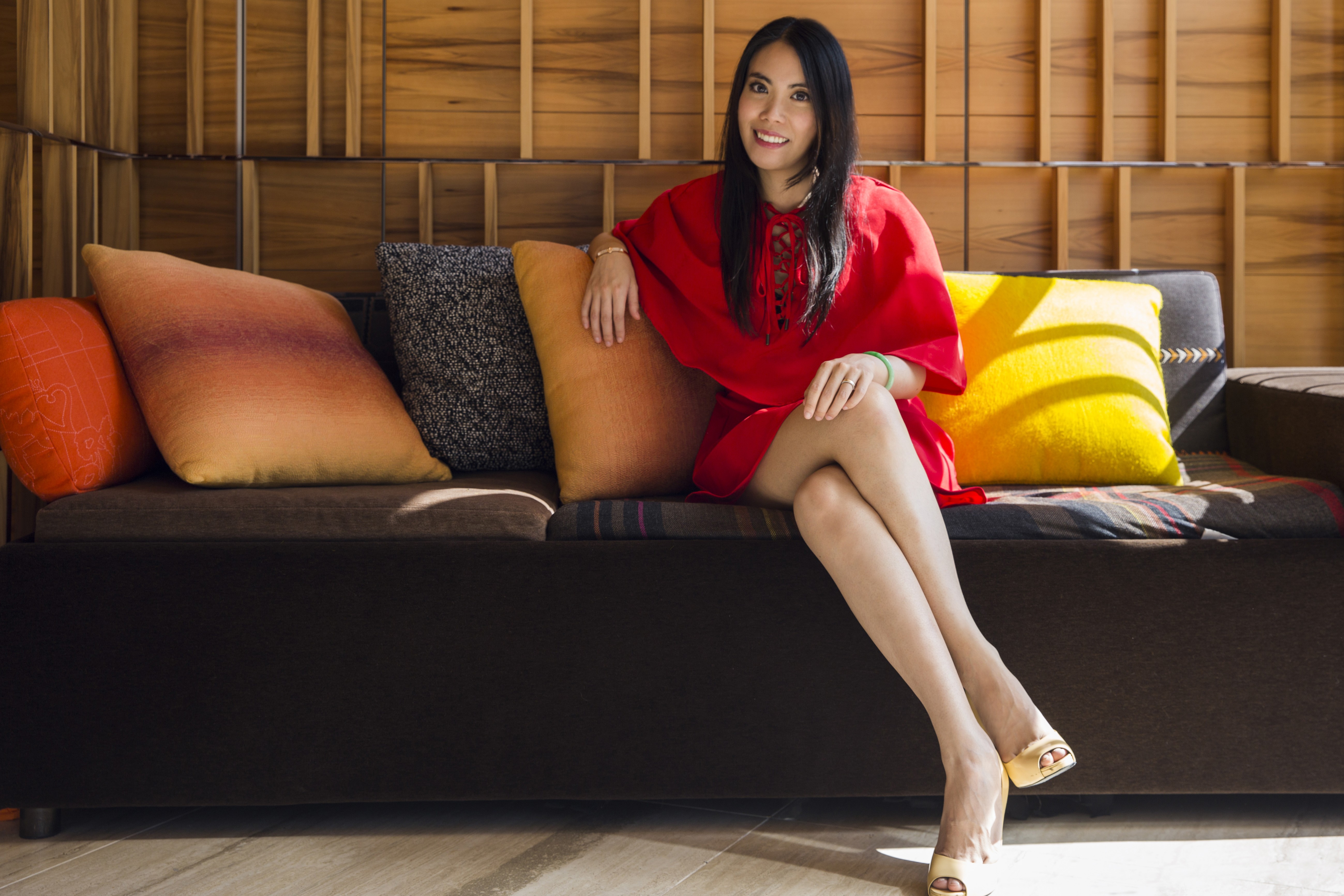 Jupyeah CFO Samathy Woo wears a red lace-up dress by Renamed, beige peep-toe pumps by Roger Vivier, a gold bracelet by Hermès, and a jade bangle. Photo: Michelle Wong